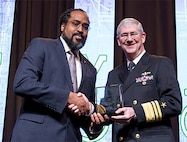 Dr. William Martin (from left), Code 8511, was presented with the Captain Donnie Cochran Legacy Award from the Black Engineer of the Year Science, Technology, Engineering and Mathematics award program by Vice Adm. Thomas Moore, NAVSEA commander, on Feb. 11 at a conference held in Washington, D.C