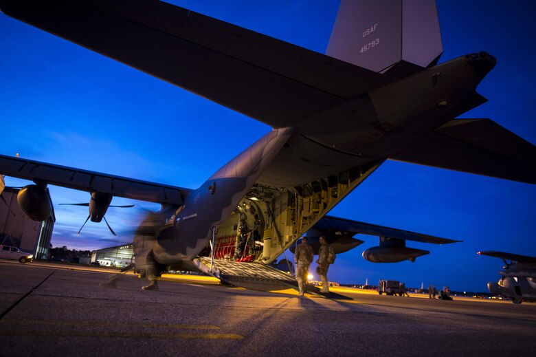 Surgical Team medics from the 720th Operations Support Squadron board an MC-130J Commando II during Emerald Warrior 17 at Hurlburt Field, Fla., March 2, 2017. Emerald Warrior is a U.S. Special Operations Command exercise during which joint special operations forces train to respond to various threats across the spectrum of conflict. (U.S. Air Force photo/Airman 1st Class Keifer Bowes)