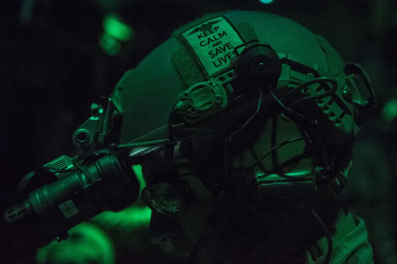 A Surgical Team medic from the 720th Operations Support Squadron administers medical care to patient on board an MC-130J Commando II during Emerald Warrior 17 at Hurlburt Field, Fla. March, 1, 2017. Emerald Warrior is a U.S. Special Operations Command exercise during which joint special operations forces train to respond to various threats across the spectrum of conflict. (U.S. Air Force photo/Airman 1st Class Keifer Bowes)