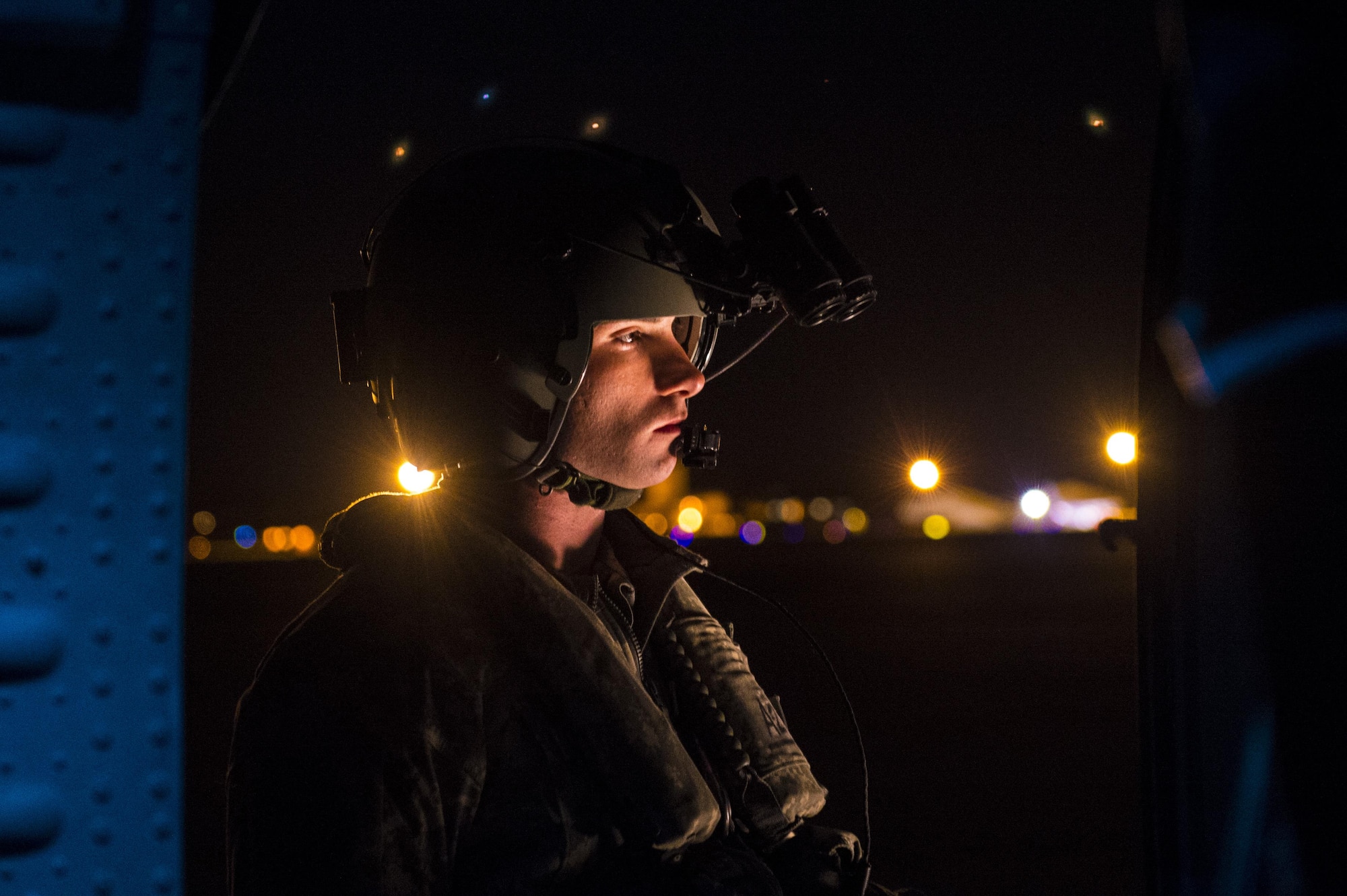 An Army crew chief performs pre-flight inspections on an UH-60L Black Hawk during Emerald Warrior 17 at Hurlburt Field, Fla., March 3, 2017. Emerald Warrior is a U.S. Special Operations Command exercise during which joint special operations forces train to respond to various threats across the spectrum of conflict. (U.S. Air Force photo/Airman 1st Class Keifer Bowes)