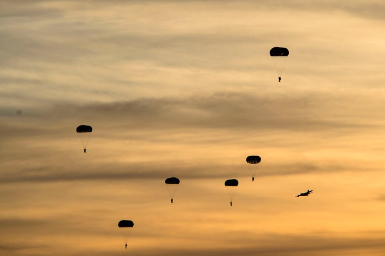 Soldiers from the 7th Special Forces Group jump from an MC-130J Commando II during Emerald Warrior 17 at Hurlburt Field, Fla., March 8, 2017. Emerald Warrior is a U.S. Special Operations Command exercise during which joint special operations forces train to respond to various threats across the spectrum of conflict. (U.S. Air Force photo/Airman 1st Class Nicholas Dutton)