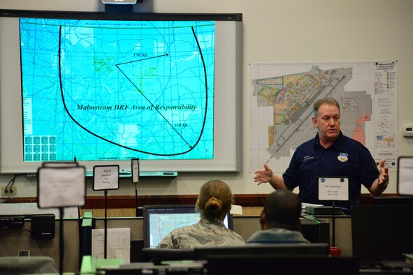 Brian Wilkinson, 341st Civil Engineer Squadron readiness and emergency management flight installation emergency manager, briefs members of the Emergency Operations Center March 9, 2017, at Malmstrom Air Force Base, Mont. Wilkinson is responsible for ensuring smooth operations inside the EOC during a time of crisis. (U.S. Air Force photo/Airman 1st Class Daniel Brosam)