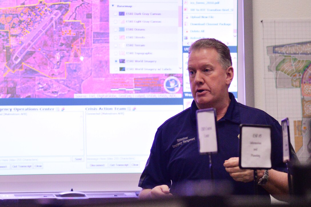 Brian Wilkinson, 341st Civil Engineer Squadron readiness and emergency management flight installation emergency manager, briefs members of the Emergency Operations Center March 9, 2017, at Malmstrom Air Force Base, Mont. In addition to working with the EOC during a crisis, Wilkinson assists with local city, county and state emergency responses and is a member of the State Emergency Response Commission and the Local Emergency Planning Committee. (U.S. Air Force photo/Airman 1st Class Daniel Brosam)