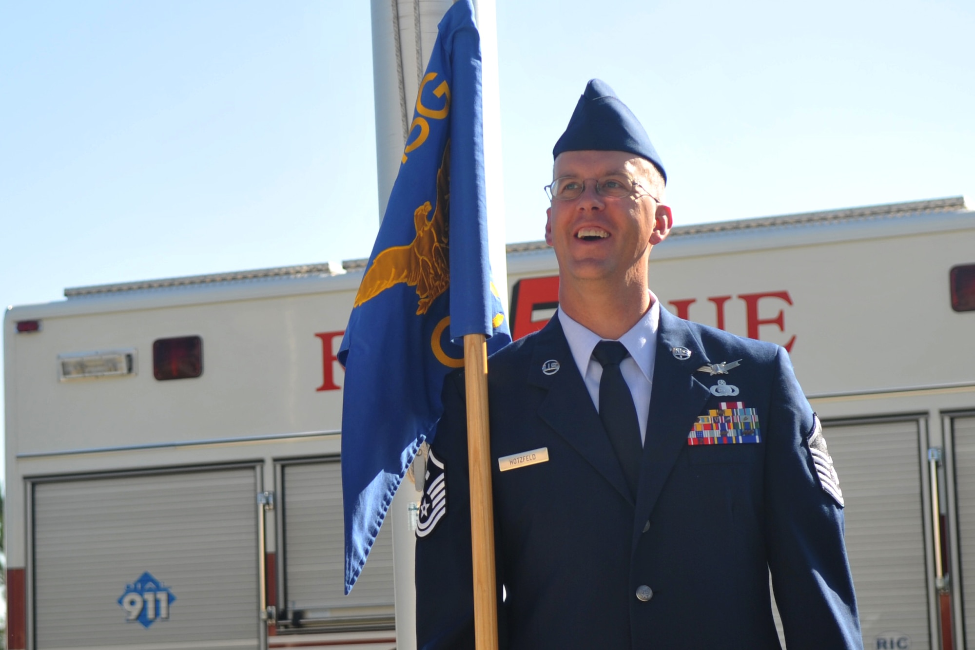Master Sgt. Robert Hotzfeld, 460th Mission Support Group first sergeant, stands with the MSG guidon July 8. 2016 on Buckley Air Force Base, Colo. Hotzfeld recently received the 2016 14th Air Force First Sergeant of the Year award. (courtesy photo)
