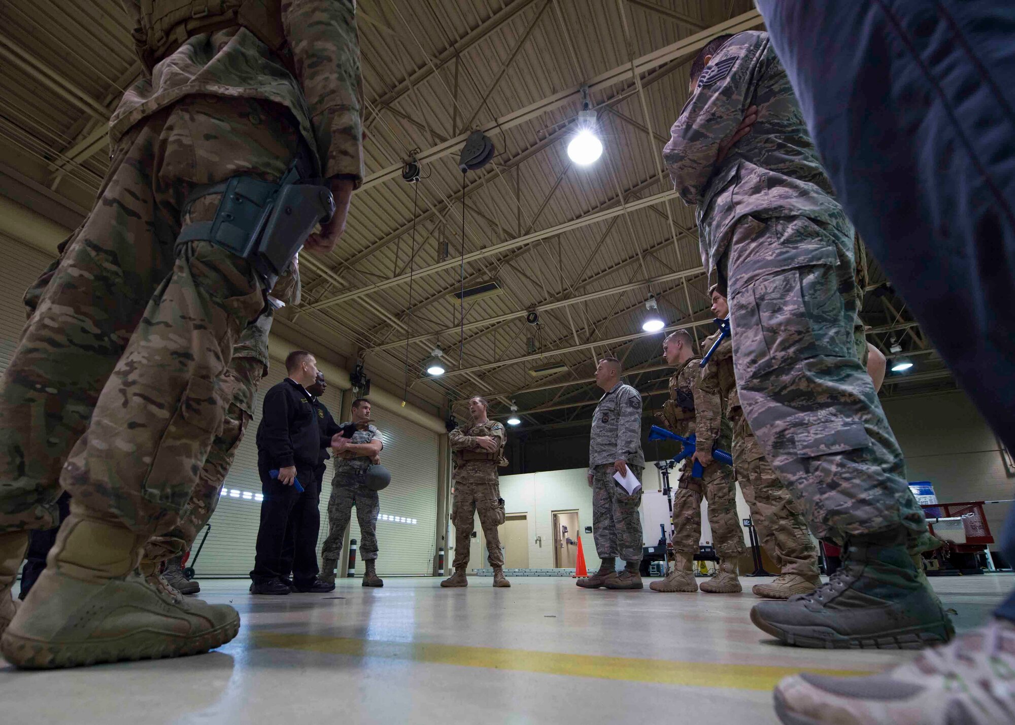 Air Commandos are briefed on new procedures for active shooter responses during multi-squadron training at Hurlburt Field, Fla., March 10, 2017. Air Commandos with the 1st Special Operations Security Forces Squadron, 1st Special Operations Civil Engineer Squadron and the 1st Special Operations Medical Group participated in an exercise to implement new procedures for tactical responders. (U.S. Air Force photo by Senior Airman Krystal M. Garrett)