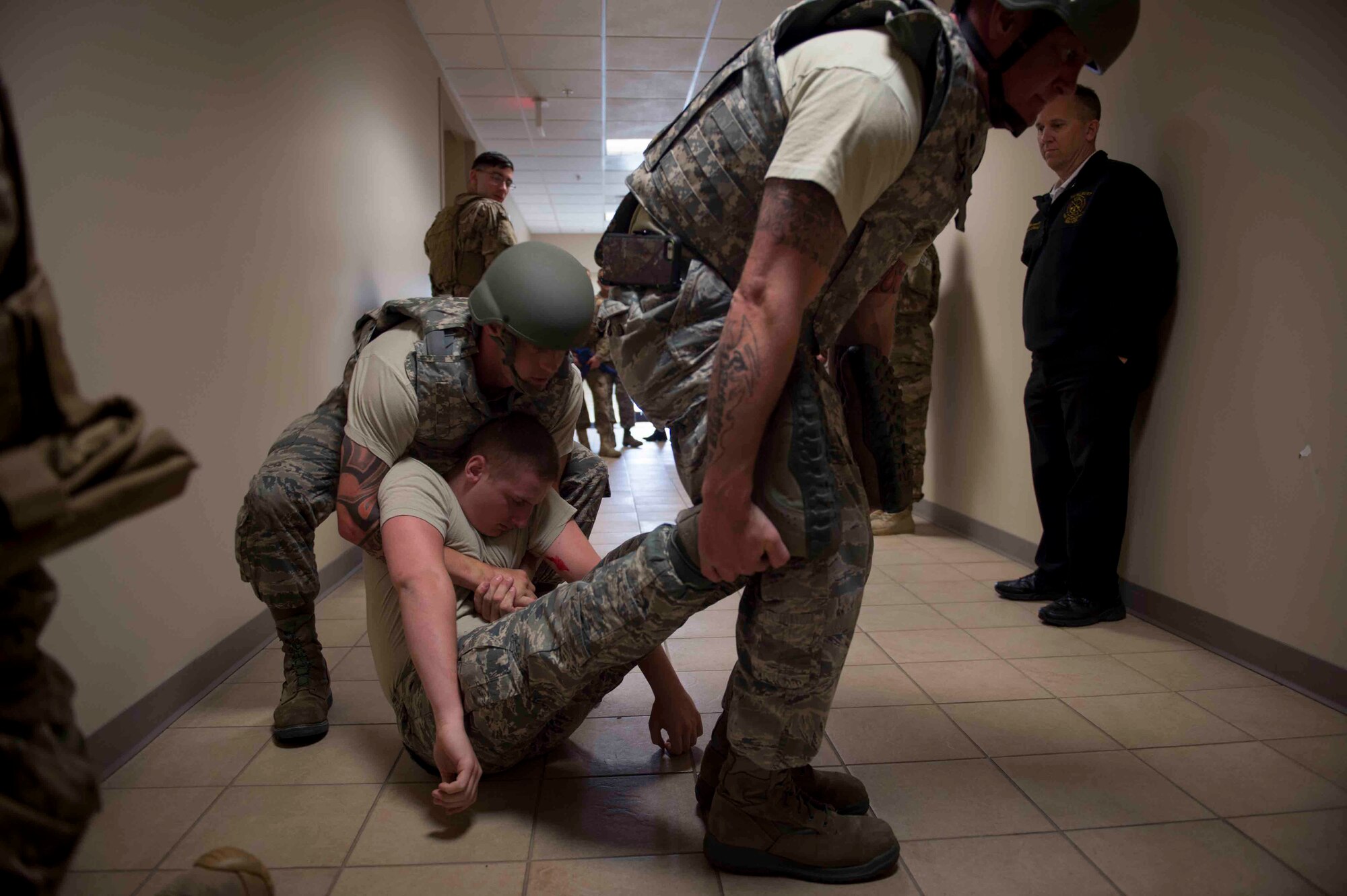 Air Commandos with the 1st Special Operations Civil Engineer Squadron perform first responder duties during an active shooter exercise at Hurlburt Field, Fla., March 10, 2017. Air Commandos with the 1st Special Operations Security Forces Squadron, 1st Special Operations Civil Engineer Squadron and the 1st Special Operations Medical Group participated in the exercise to practice new procedures for tactical responders. (U.S. Air Force photo by Senior Airman Krystal M. Garrett)