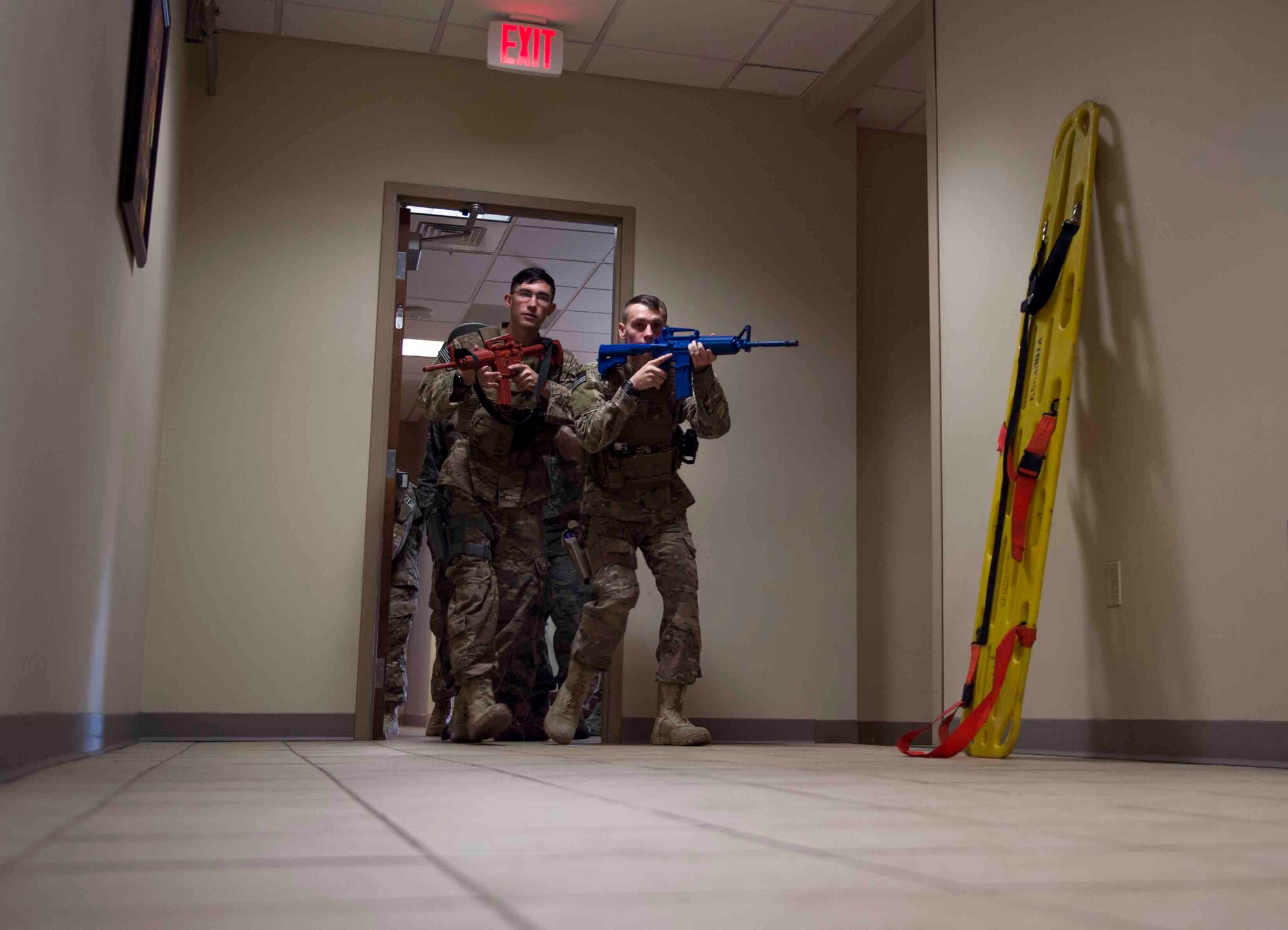 Air Commandos with the 1st Special Operations Security Forces and the 1st Special Operations Civil Engineer Squadron perform first responder duties during an active shooter exercise at Hurlburt Field, Fla., March 10, 2017. Air Commandos with the 1st Special Operations Security Forces Squadron, 1st SOCES and the 1st Special Operations Medical Group participated in an exercise to implement new procedures for tactical responders. (U.S. Air Force photo by Senior Airman Krystal M. Garrett)