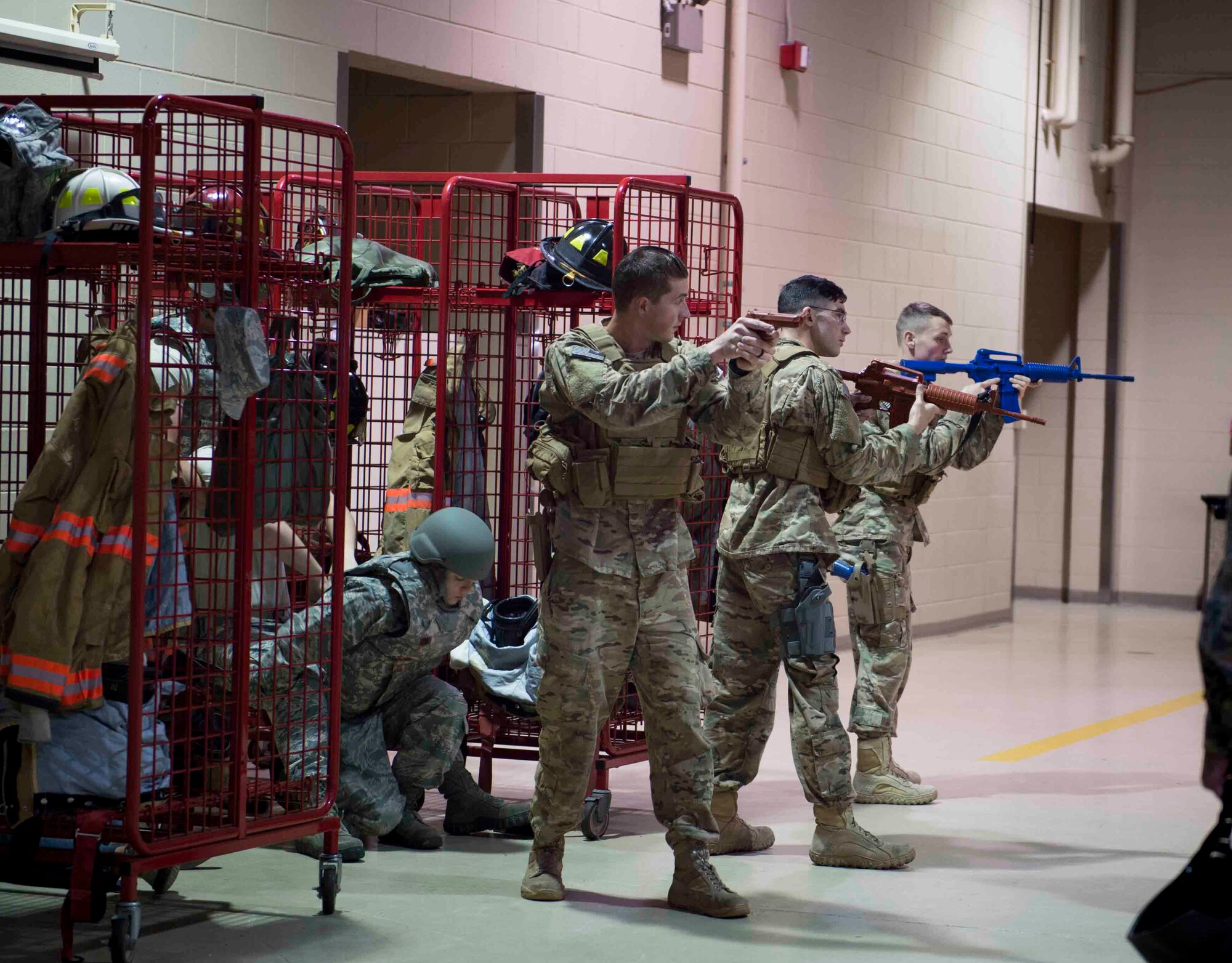 Air Commandos with the 1st Special Operations Security Forces and the 1st Special Operations Civil Engineer Squadron perform first responder duties during an active shooter exercise at Hurlburt Field, Fla., March 10, 2017. Air Commandos with the 1st Special Operations Security Forces Squadron, 1st SOCES and the 1st Special Operations Medical Group participated in an exercise to implement new procedures for tactical responders. (U.S. Air Force photo by Senior Airman Krystal M. Garrett)