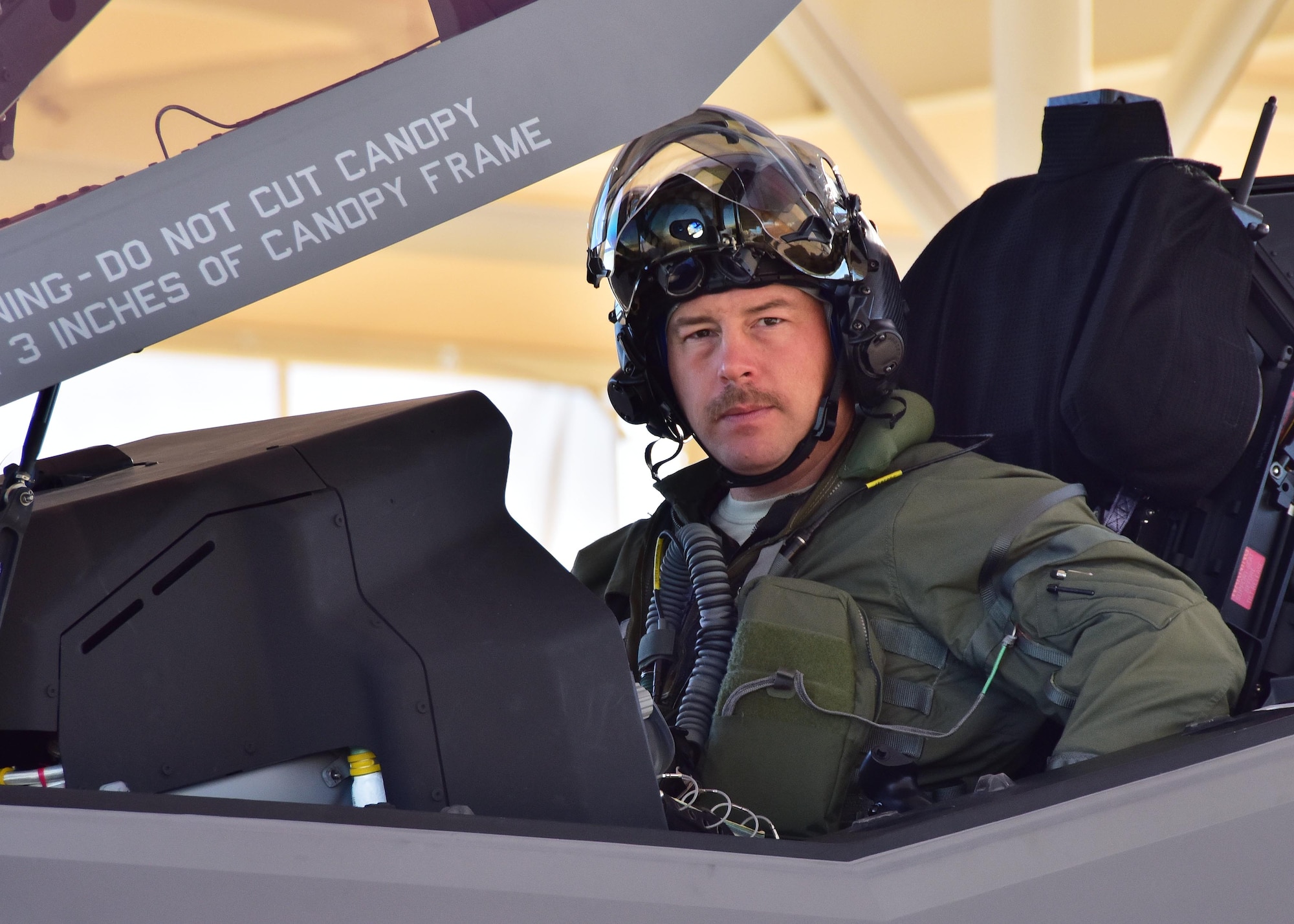 Maj. Michael “Frog” Hobson, 944th Operations Group Detachment 2, poses for a photo Mar. 7 before taking off on the 100th sortie milestone at Luke Air Force Base, Ariz. (U.S. Air Force photo by Tech. Sgt. Louis Vega Jr.)