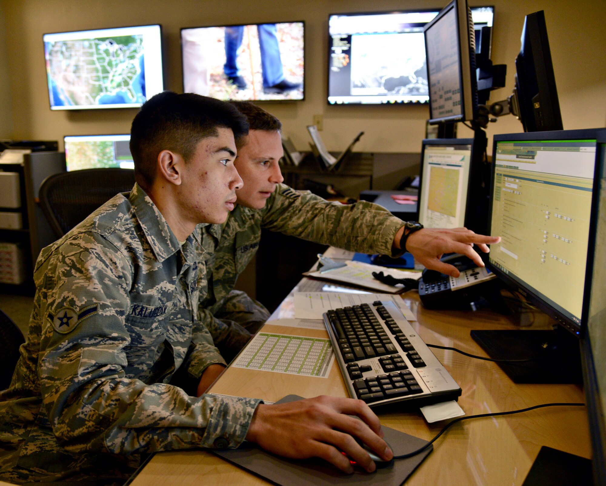 Airman Ryan Kalugdan and Staff Sgt. Chris Hansen, both with the 72nd Operations Support Squadron’s Weather Center, issued weather warnings, watches and advisories base wide throughout the day during Tinker’s annual natural disaster exercise Feb. 27. The weather center continuously monitors local and national weather sites to keep Tinker personnel fully informed and prepared in case of a real world emergency situation. Although the natural disaster exercise is not an Air Force-required exercise, it is important for all base personnel to stay fully aware of response procedures, especially with Oklahoma’s unpredictable spring weather. (Air Force photo by Kelly White)