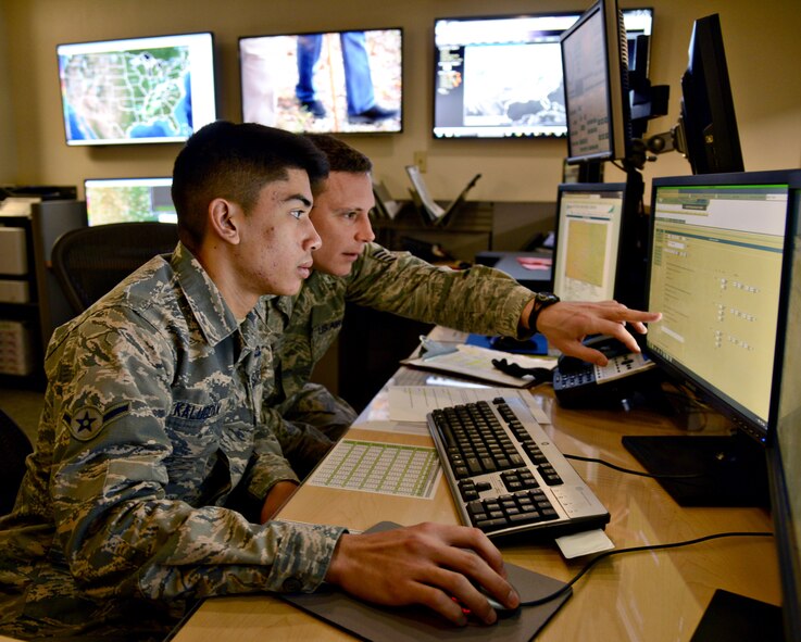 Airman Ryan Kalugdan and Staff Sgt. Chris Hansen, both with the 72nd Operations Support Squadron’s Weather Center, issued weather warnings, watches and advisories base wide throughout the day during Tinker’s annual natural disaster exercise Feb. 27. The weather center continuously monitors local and national weather sites to keep Tinker personnel fully informed and prepared in case of a real world emergency situation. Although the natural disaster exercise is not an Air Force-required exercise, it is important for all base personnel to stay fully aware of response procedures, especially with Oklahoma’s unpredictable spring weather. (Air Force photo by Kelly White)