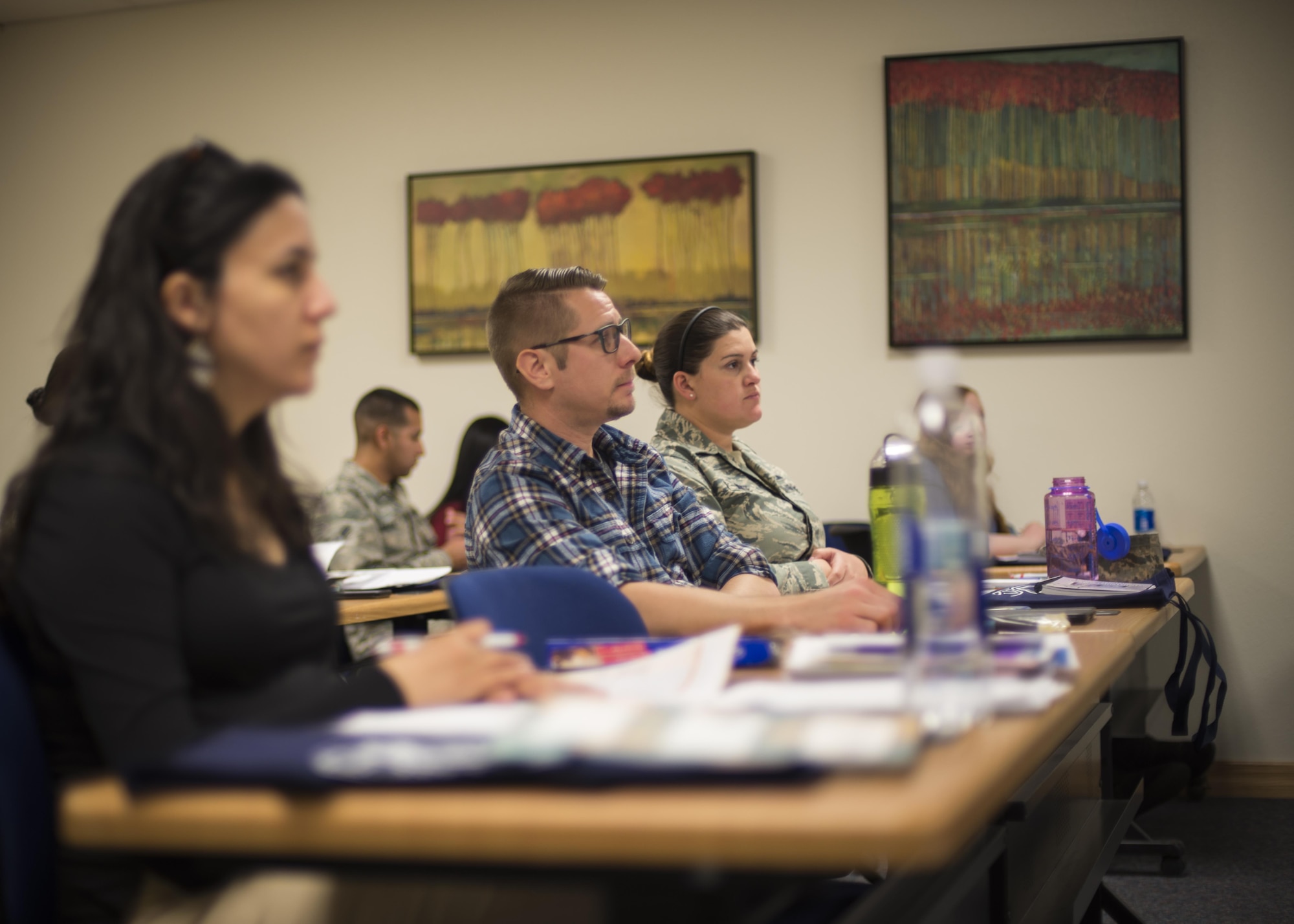 Parents listen to a briefer during a Bundles for Babies class at the Airman and Family Readiness Center at Holloman Air Force Base, N.M., on Feb. 28, 2017. Between 126 and 264 families, consisting of both new and experienced parents, attend the class each year to learn about the various resources available to them, from child birthing classes to dental and medical assistance. (U.S. Air Force photo by Airman 1st Class Alexis P. Docherty)