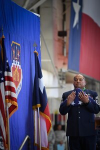 Command Chief Master Sgt. George Longoria holds an American flag during his retirement ceremony at Joint Base San Antonio-Lackland, Texas, Feb. 25, 2017. Longoria retires after 35 years of service with the 149th Fighter Wing, Texas Air National Guard. (U.S. Air National Guard photo by Tech. Sgt. Eric L. Wilson)