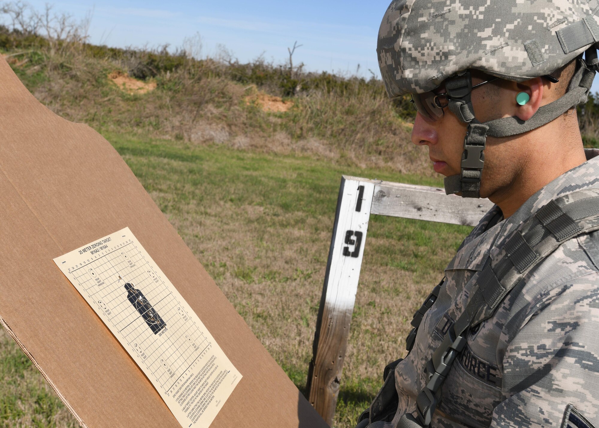 U.S. Air Force Senior Airman Orlando Duarte, an aerospace propulsion mechanic with the 149th Fighter Wing, Texas Air National Guard, headquartered at Joint Base San Antonio-Lackland, Texas, inspects his M4 carbine shot grouping during the Texas Military Department’s Best Warrior Competition March 2, 2017 at Camp Swift, Bastrop, Texas. During the BWC competitors had the opportunity to zero their weapons before moving on to the M4 qualification course. (Air National Guard photo by Senior Airman De’Jon Williams)
