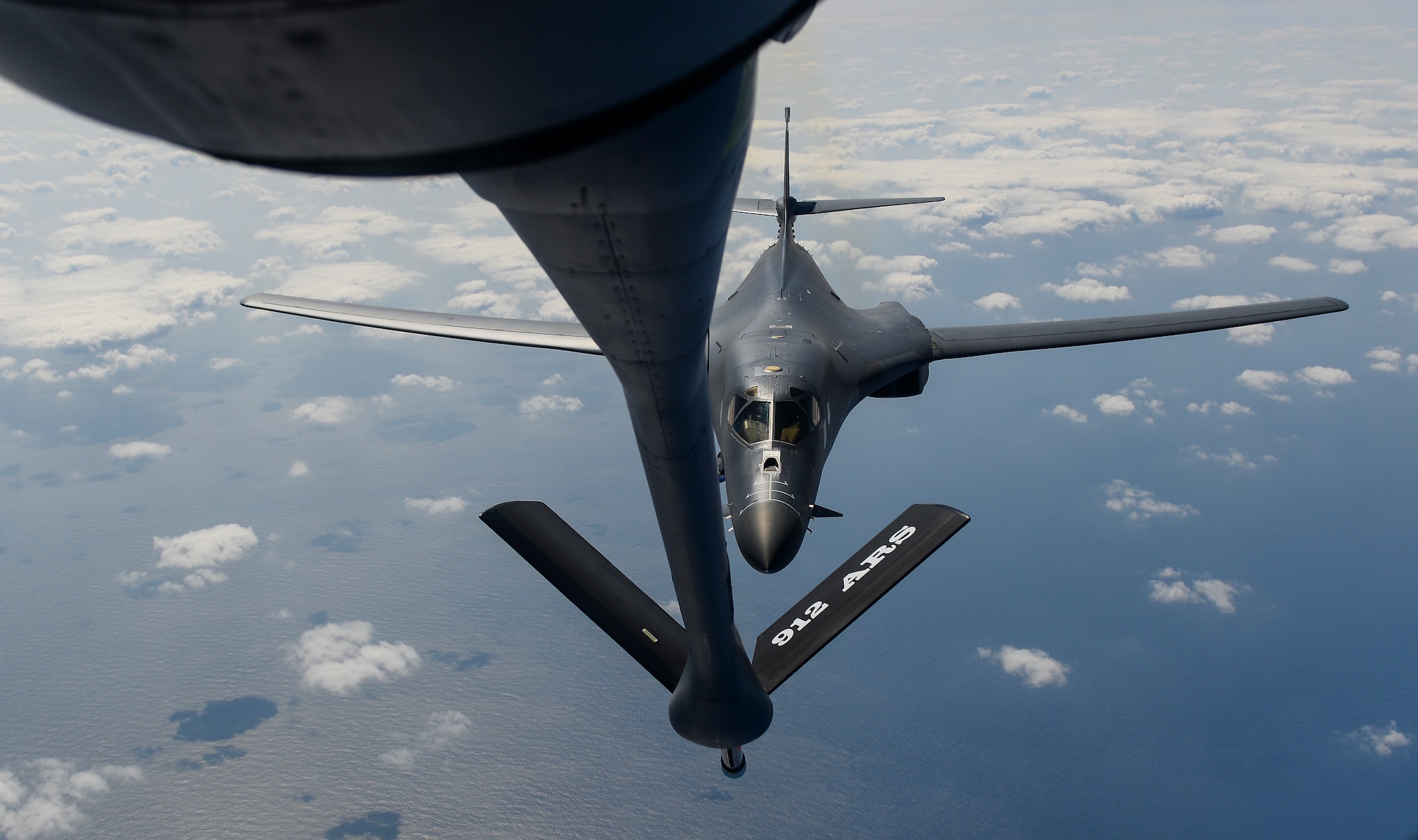 A U.S. Air Force B-1B Lancer assigned to the 9th Expeditionary Bomb Squadron, deployed to Andersen Air Force Base, Guam, receives fuel from a KC-135 Stratotanker over the Pacific Ocean March 10, 2017. The B-1B's are deployed to Andersen as part of U.S. Pacific Command's (USPACOM) Continuous Bomber Presence operations. This forward deployed presence demonstrates continuing U.S. commitment to stability and security in the Indo-Asia-Pacific region. Most importantly, these bomber rotations provide Pacific Air Forces and USPACOM commanders an extended deterrence capability. (U.S. Air Force photo by Airman 1st Class Christopher E. Quail)