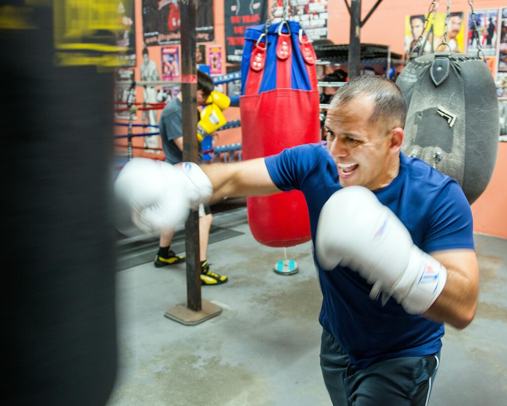 U.S. Air Force Capt. Eduardo Torrez, 60th Medical Operations Squadron, Travis Air Force Base, Calif., performs boxing drills at the JL Tepito Boxing Club in Fairfield, Calif., Feb. 27, 2017. Torrez is a nurse at David Grant USAF Medical Center and was an amateur boxer before joining the Air Force. (U.S. Air Force photo/Louis Briscese)