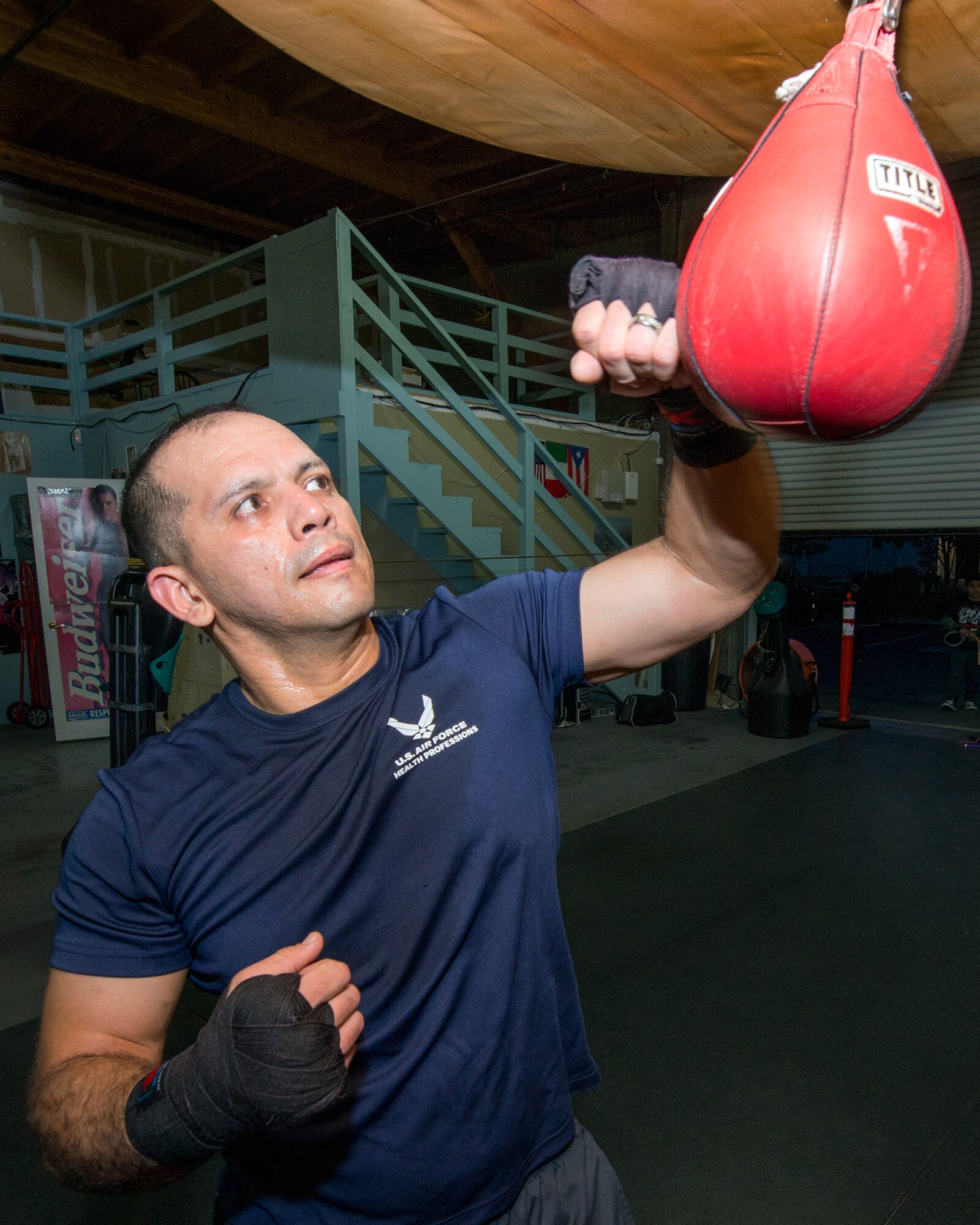 U.S. Air Force Capt. Eduardo Torrez, 60th Medical Operations Squadron, Travis Air Force Base, Calif., performs boxing drills at the JL Tepito Boxing Club in Fairfield, Calif., Feb. 27, 2017. Torrez is a nurse at David Grant USAF Medical Center and was an amateur boxer before joining the Air Force. (U.S. Air Force photo/Louis Briscese)