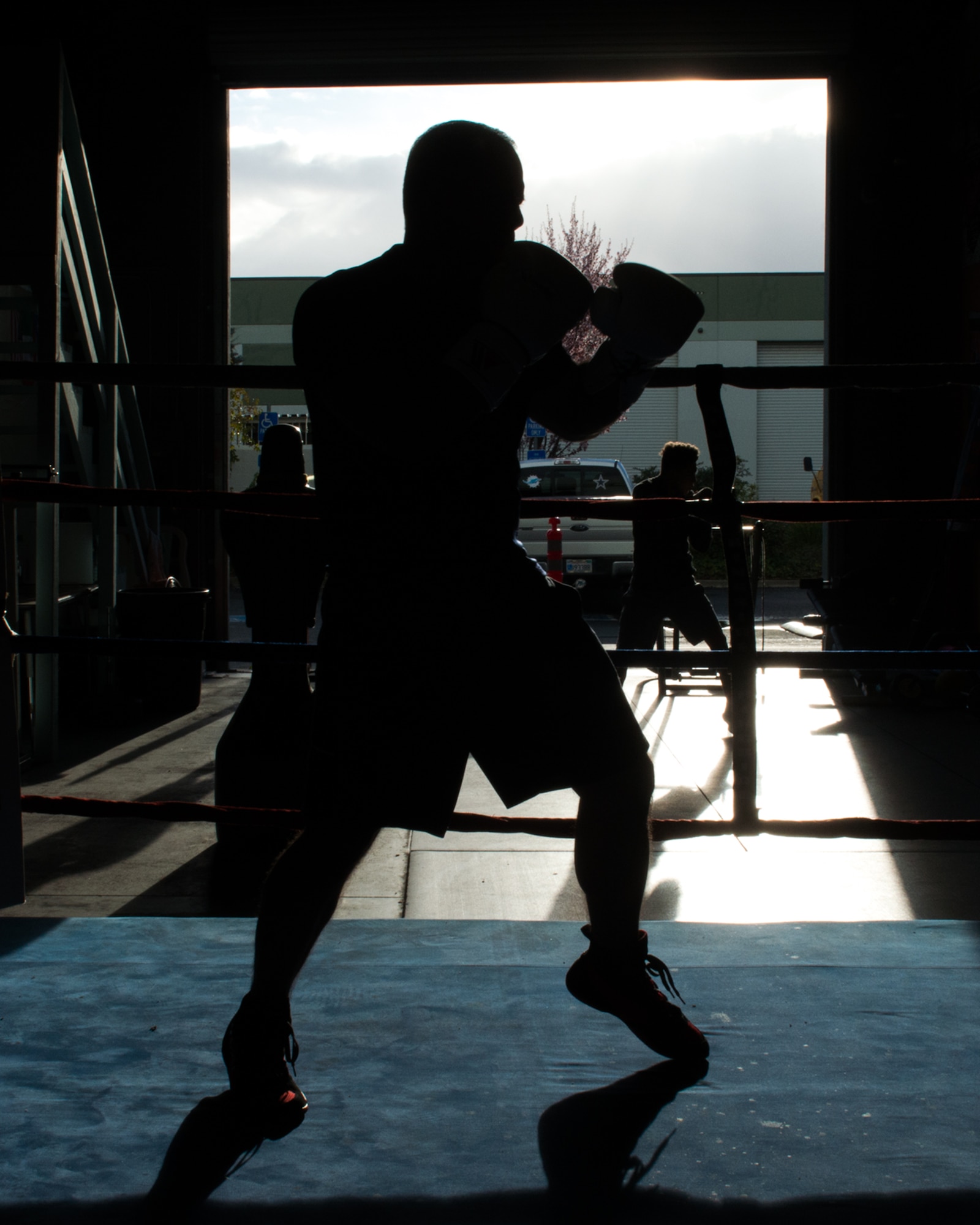 U.S. Air Force Capt. Eduardo Torrez, 60th Medical Operations Squadron, Travis Air Force Base, Calif., performs boxing drills with Jesse Lopez at the JL Tepito Boxing Club in Fairfield, Calif., Mar. 6, 2017. Torrez is a nurse at David Grant USAF Medical Center and was an amateur boxer before joining the Air Force. (U.S. Air Force photo/Louis Briscese)