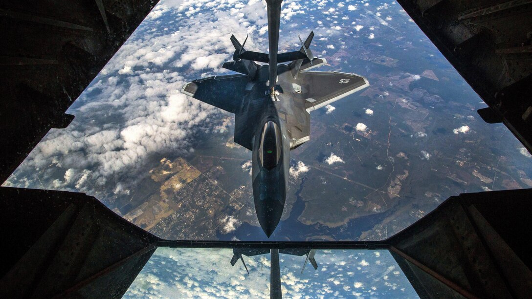 An F-22 Raptor receives fuel from a KC-10 Extender over the Florida coast during Response 17, a crisis mobilization exercise, March 7, 2017. Air Force photo by Master Sgt. Mark C. Olsen
