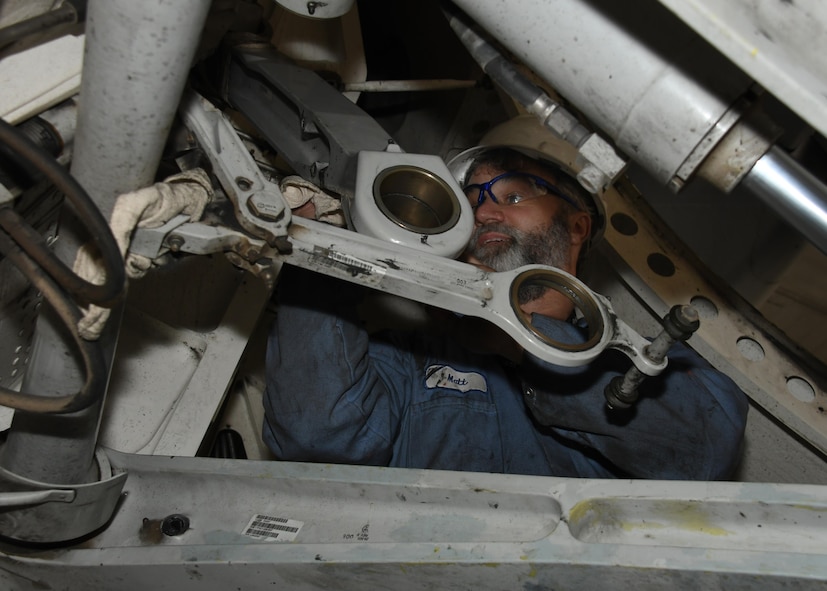 Matt Sanchez, a contractor mechanic with Boeing, works on separating the upper cross shaft on a U.S. Air Force C-17 Globemaster III at Al Udeid Air Base, Qatar, Feb. 25, 2017. The aircraft needed extensive maintenance to its landing gear and required a team from Boeing to come out and fix it. (U.S. Air Force photo by Senior Airman Miles Wilson)
