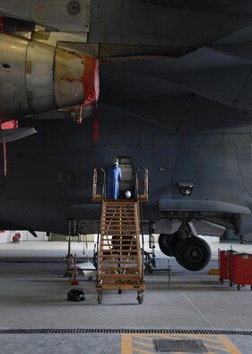 Bruce Natale, left, and Matt Sanchez, contractor mechanics with Boeing, work on a U.S. Air Force C-17 Globemaster III at Al Udeid Air Base, Qatar, Feb. 25, 2017. Two C-17 aircraft required extensive maintenance to their landing gear and required a team from Boeing to come out and fix them. (U.S. Air Force photo by Senior Airman Miles Wilson)