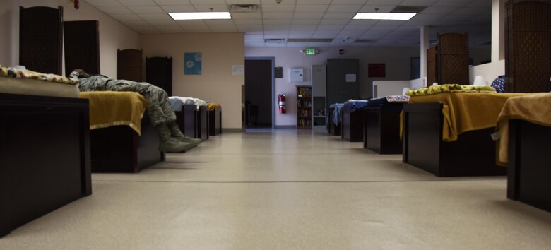 An Airman rests in the en-route patient staging facility at Al Udeid Air Base, Qatar, March 8, 2017. Aerospace medical technicians with the 379th Expeditionary Medical Group maintain the ERPSF which is critical to patient care during their stay and is designed to provide patient holding capabilities for personnel in transit for aeromedical evacuation. (U.S. Air Force photo by Senior Airman Cynthia A. Innocenti)