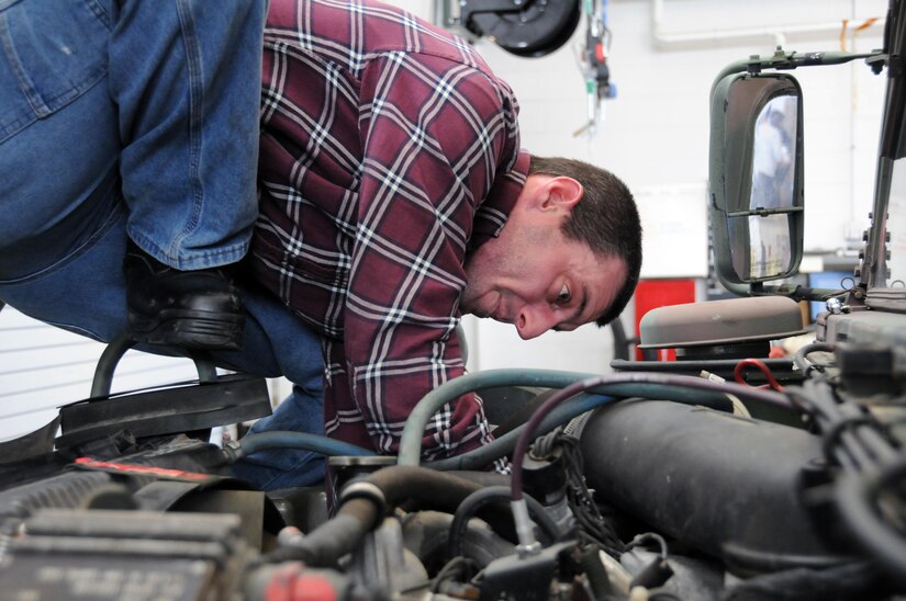 Paul Bettit, a heavy mobile equipment repairman at the U.S. Army Reserve's equipment concentration site 27 at Joint Base McGuire-Dix-Lakehurst, New Jersey, works on a High Mobility Multipurpose Wheeled Vehicle.  Mechanics at ECS 27 are busy preparing vehicles and equipment for the 78th Training Division's Warrior Exercise, happening later this month.