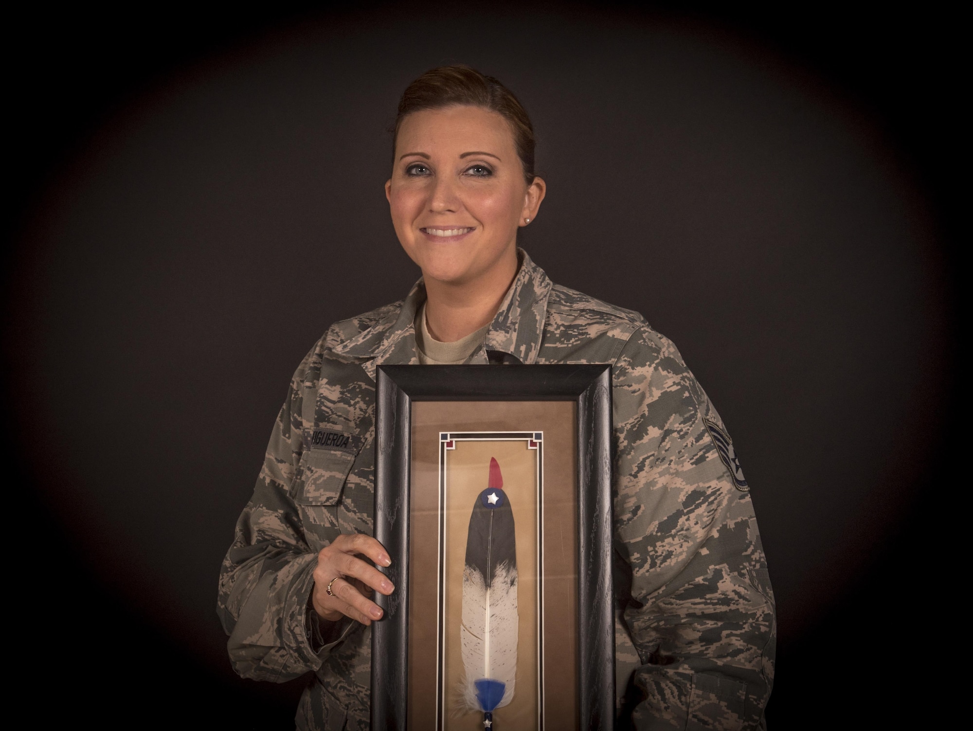 U.S. Air Force Staff Sgt. Thereasa Barker-Figueroa from the New Jersey Air National Guard's 108th Wing holds her 2016 Military Meritorious Service Award she was presented by the Society of American Indian Government Employees, Joint Base McGuire-Dix-Lakehurst, N.J., Oct. 4, 2016. Barker-Figueroa traces her lineage to the Lenni-Lenape, a group of Native American people from the Algonquin nation who populated New Jersey as well as parts of Pennsylvania and New York. (U.S. Air National Guard photo by Tech. Sgt. Matt Hecht/Released)