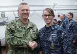 YOKOSUKA, Japan (March 3, 2017) Capt. Jeffrey T. Griffin, Chief of Staff for U.S. 7th Fleet, left, and Hospital Corpsman 3rd Class Sarah D. Clark, assigned to Destroyer Squadron (DESRON) 15, right, pose for a photo at an awards ceremony where Clark received a Navy and Marine Corps Achievement Medal for rendering aid to a young woman in distress. 