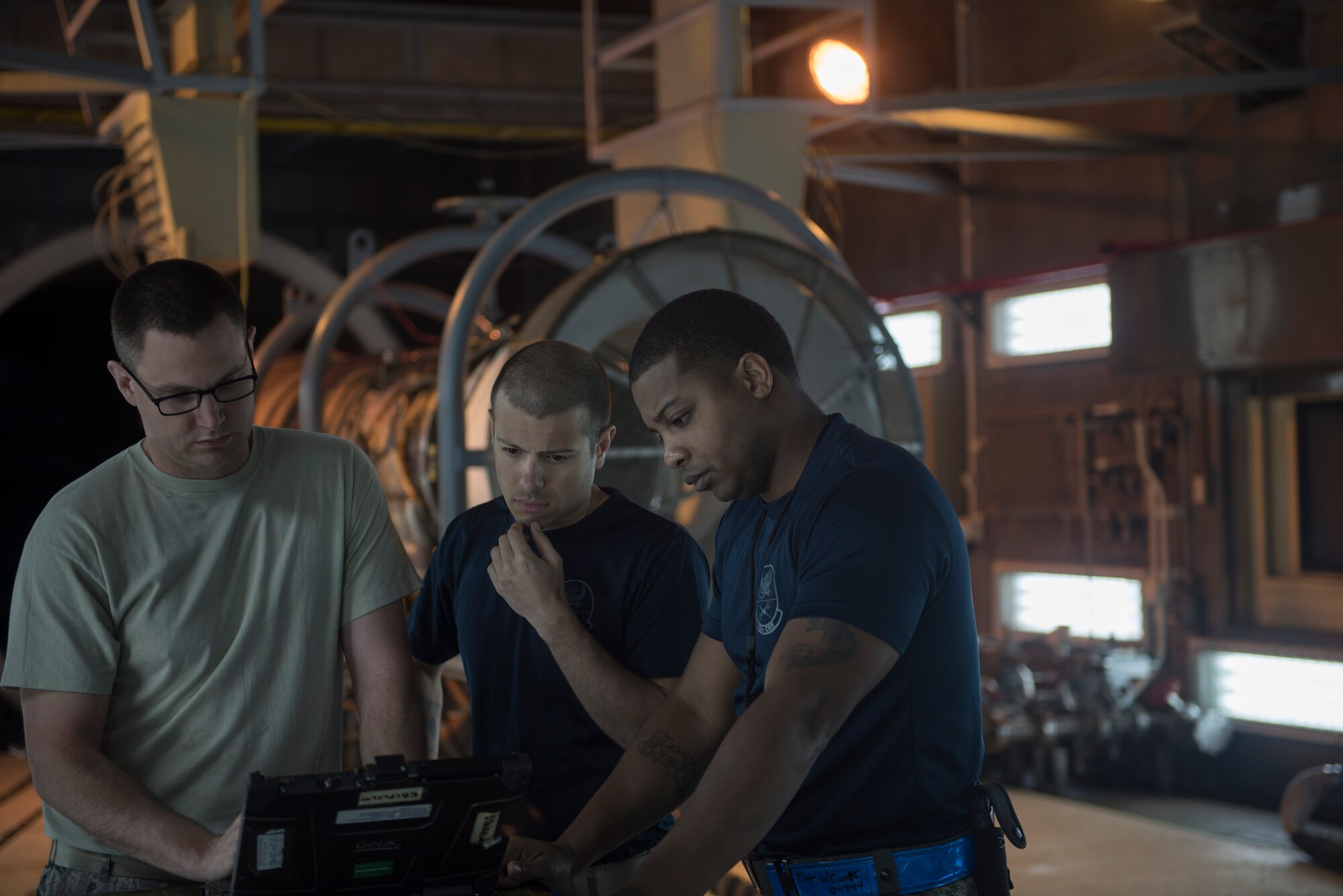 U.S. Air Force Airmen assigned to the 18th Component Maintenance Squadron research inspection limits March 10, 2017, at Kadena Air Base, Japan. Ensuring every part of the engine is ready and safe is of the highest priority when it comes to keeping the mission moving. (U.S. Air Force photo by Airman 1st Class Quay Drawdy)