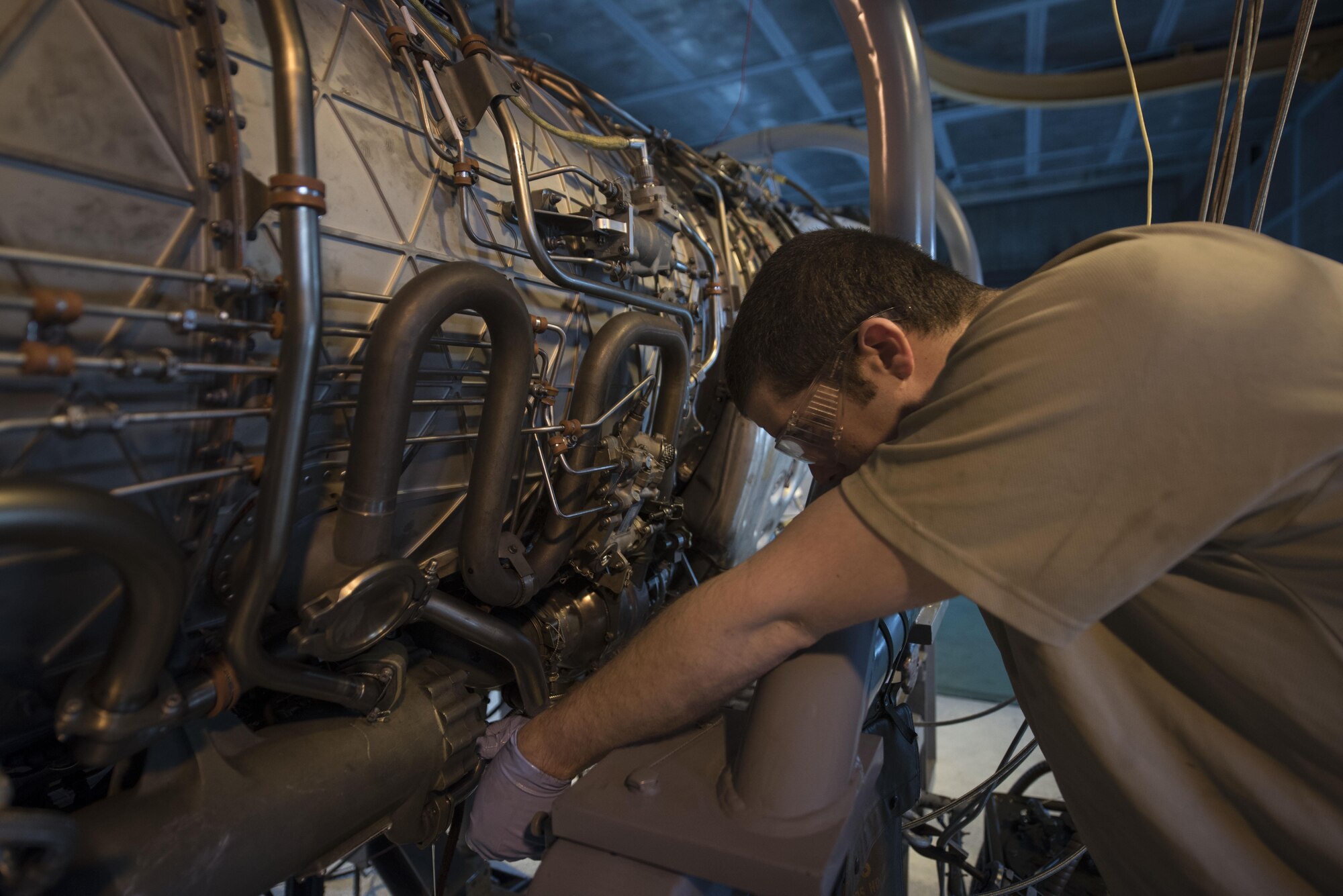 U.S. Air Force Staff Sgt. Donovan Walters, 18th Component Maintenance Squadron aerospace propulsion craftsman, checks a valve on a F100/220 engine March 10, 2017, at Kadena Air Base, Japan. Whenever a new core is installed, the entire unit goes through a “break-in” process. (U.S. Air Force photo by Airman 1st Class Quay Drawdy)