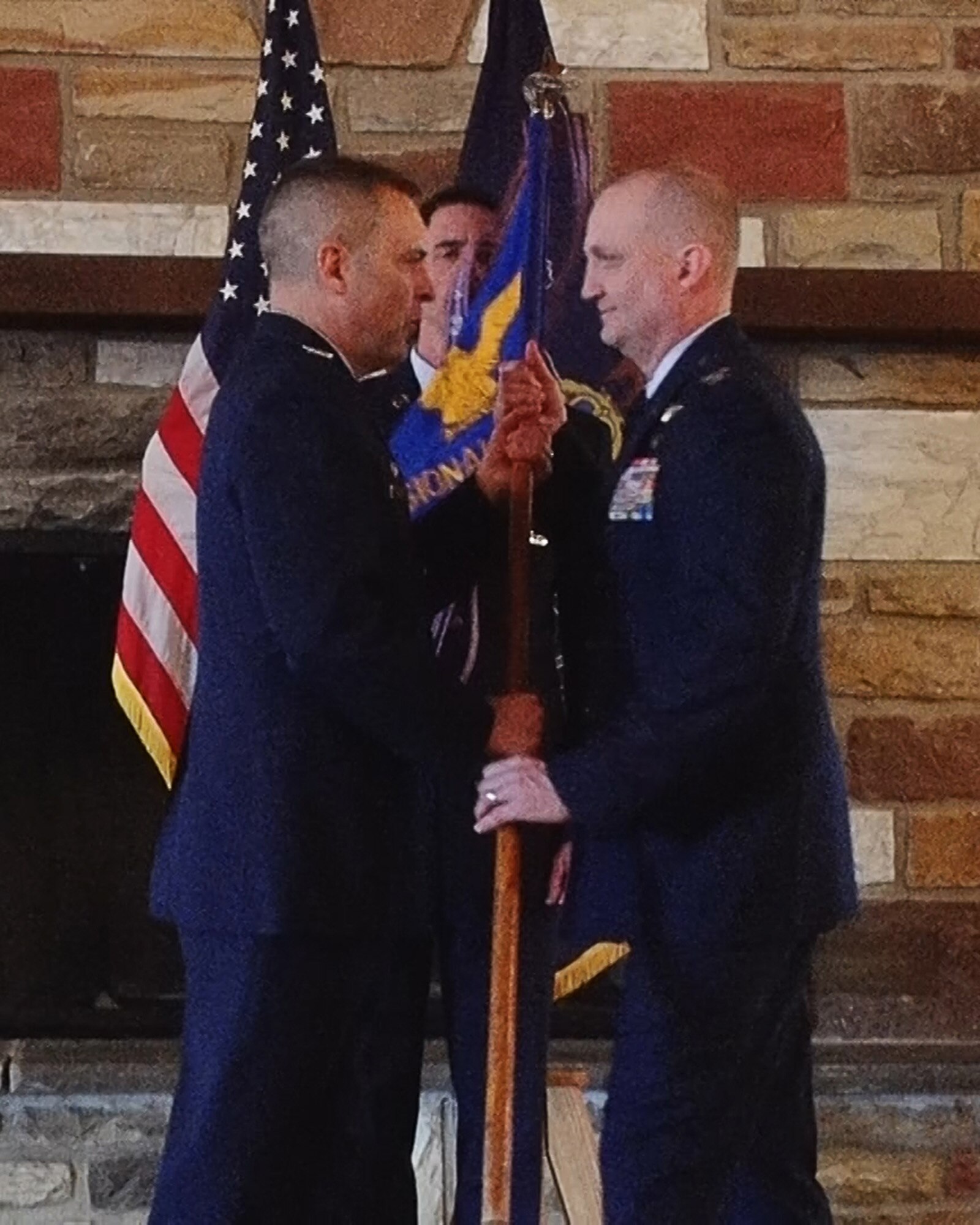 Col. Mike Cason (left), 193rd Special Operations Wing commander, presents the guidon to Col. Stacey Zdanavage (right), the new 193rd Regional Support Group commander, during an assumption of command ceremony March 11, 2017, Annville, Pennsylvania. The ceremony began with his promotion, preliminary honors and ended with the symbolic passing of the guidon. (U.S. Air National Guard photo by Master Sgt. Matt Schwartz/Released)