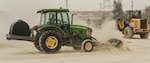 U.S. Air Force Airman 1st Class Cameron Pinkerton, a 18th Civil Engineer Group pavement maintenance and heavy equipment operator, uses a sweeper to clear rocks from a simulated repaired runway at the munitions storage area of Kadena Air Base, Japan, March 3, 2017. The Air Force, Navy and Marine Corps worked side by side, trading different approaches to the same problems, bolstering the others ability to work with their sister services in any situation, planned or otherwise. (U.S. Air Force photo by Senior Airman Nick Emerick/Released) 