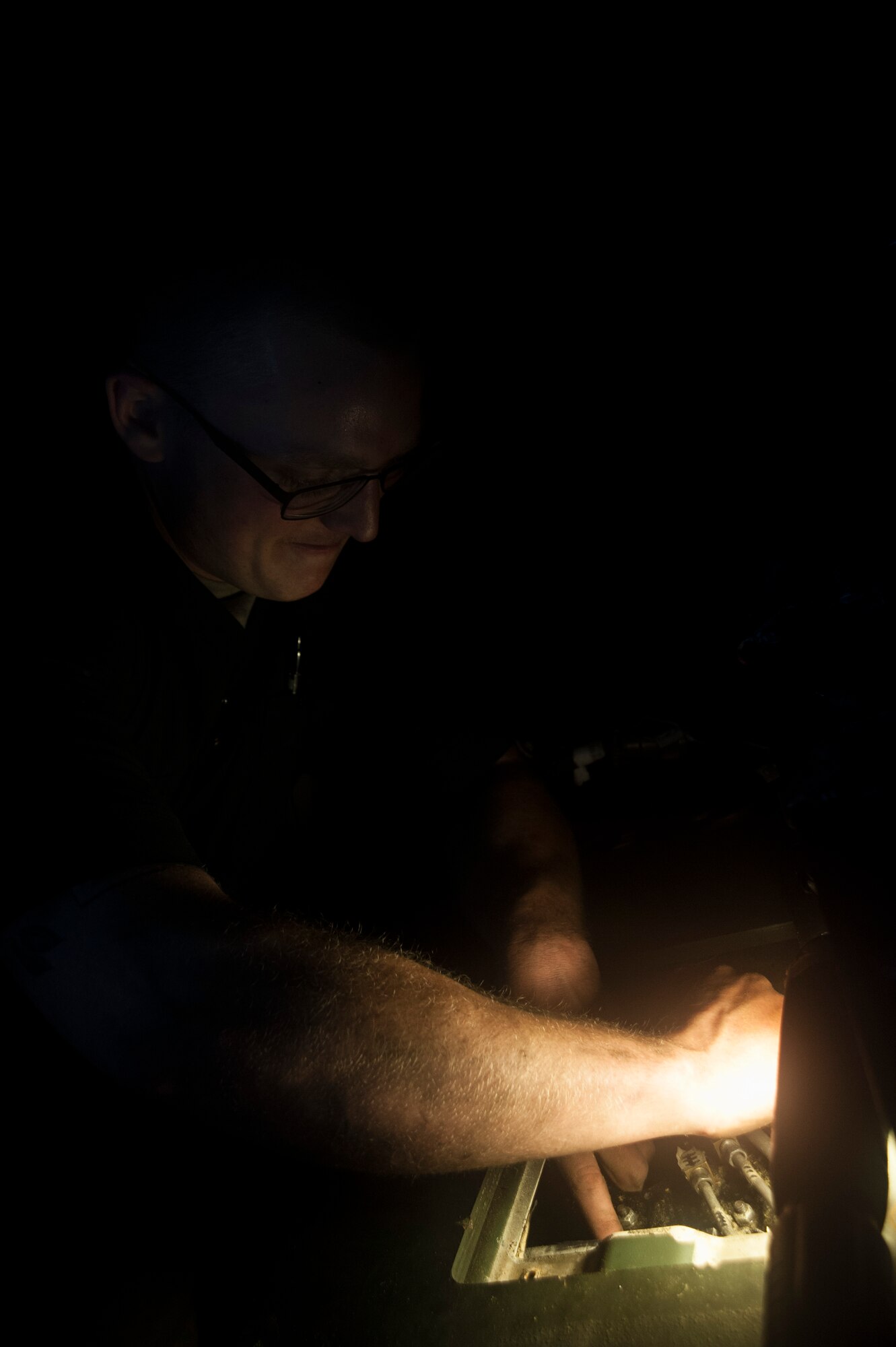 U.S. Air Force Airman 1st Class Conner Worthington, 18th Logistics Readiness Squadron vehicle maintenance apprentice, attaches fuel lines March 13, 2017, at Kadena Air Base, Japan. Up-to-date maintenance is key to ensuring things like flight line operations get accomplished on time. (U.S. Air Force photo by Airman 1st Class Quay Drawdy)
