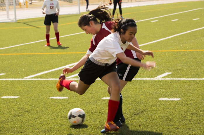 A Marist Brothers International School soccer player attempts to take control of the soccer ball from an E.J. King High School player on M.C. Perry Sports Field at Marine Corps Air Station, Iwakuni, Japan, March 11, 2017. The Marist Brothers International School soccer team finished the tournament in second place, followed by E.J. King High School in third, and Nagoya International School in fourth. (U.S. Marine Corps photo my Pfc. Stephen Campbell)