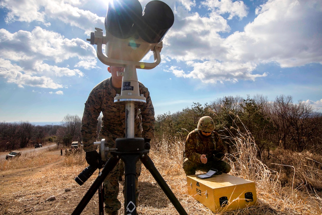 U.S. Marine Corps Sgt. Isaac Ibarra, foreground, looks downrange during exercise Forest Light 17 at Somagahara, Japan, March 8, 2017. Ibarra is a combat correspondent assigned to 3rd Marine Headquarters Group, 3rd Marine Expeditionary Force. Marine Corps photo by Lance Cpl. Juan C. Bustos