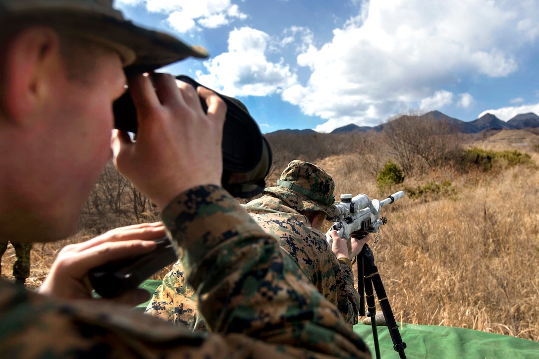 Marine Corps Cpl. Tyler Harbert, front, fires at a target from the prone position as his spotter observes the target during exercise Forest Light 17 at Somagahara, Japan, March 8, 2017. Harbert is assigned to Golf Company, 2nd Battalion, 3rd Marine Regiment, 3rd Marine Expeditionary Force. Marine Corps photo by Lance Cpl. Juan C. Bustos