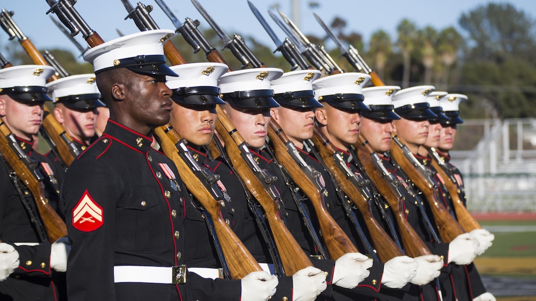 U.S. Marines with the United States Marine Corps Silent Drill Platoon, Battle Color Detachment, Marine Barracks Washington, D.C., perform during the Battle Color Ceremony at the 11 Area football field on Marine Corps Base Camp Pendleton, Calif., March 9, 2017. The ceremony featured “The Commandant’s Own," the United States Marine Drum & Bugle Corps, the Silent Drill Platoon, and the Official Color Guard of the Marine Corps.
