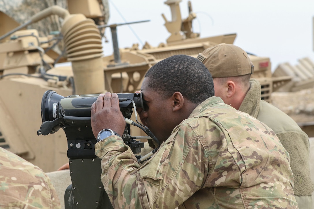 U.S. Army 1st Lt. Henry Manning, deployed in support of Combined Joint Task Force-Operation Inherent Resolve, assigned to 2nd Brigade Combat Team, 82nd Airborne Division, observes a target being struck by coalition artillery near Al Tarab, Iraq, during the offensive to liberate West Mosul from ISIS, March 11, 2017. The strikes were conducted to support the Iraqi security forces' operation to liberate West Mosul from ISIS. CJTF-OIR is the global Coalition to defeat ISIS in Iraq and Syria. (U.S. Army photo by Staff Sgt. Jason Hull)