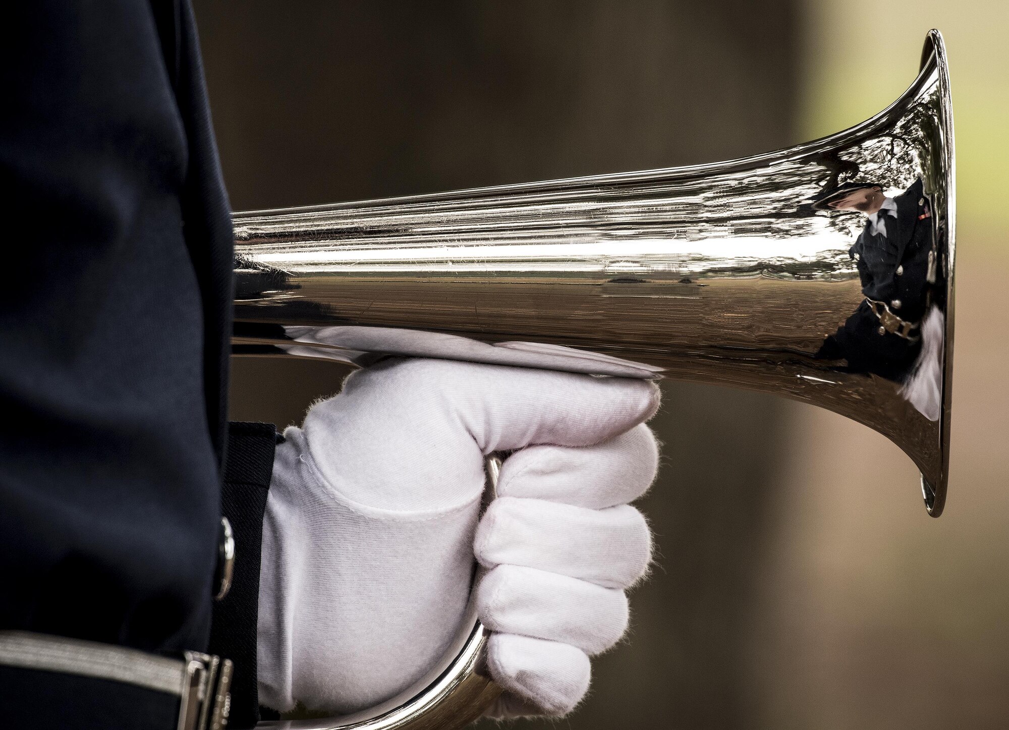 A new Honor Guard Airman grips the bugle prior to unit’s graduation ceremony at Eglin Air Force Base, Fla., March 1.  Approximately 12 new Airmen graduated from the 120-plus-hour course. The graduation performance includes flag detail, rifle volley, pall bearers and bugler for friends, family and unit commanders. (U.S. Air Force photo/Samuel King Jr.)