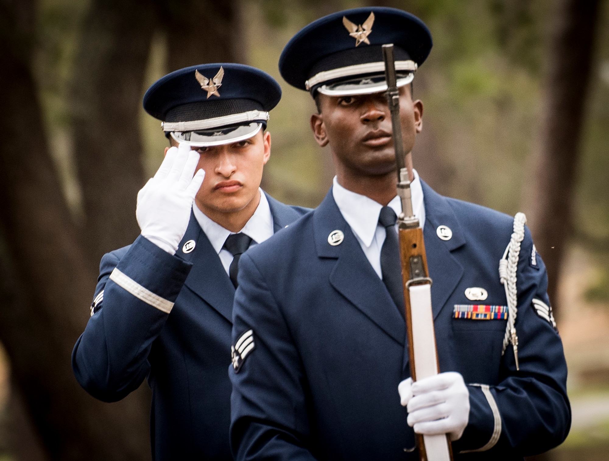 Senior Airmen Blake Banning and Kadeem Bell stand at “present arms” after their rifle volley procedures during the unit’s graduation ceremony at Eglin Air Force Base, Fla., March 1.  Approximately 12 new Airmen graduated from the 120-plus-hour course. The graduation performance includes flag detail, rifle volley, pall bearers and bugler for friends, family and unit commanders. (U.S. Air Force photo/Samuel King Jr.)