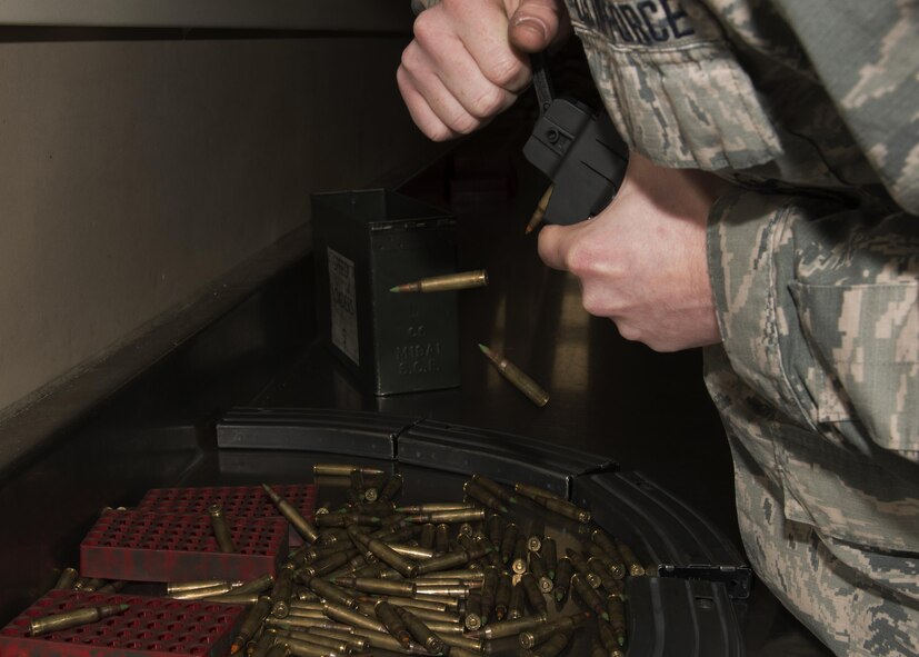 Airman 1st Class Cody Daganhart, 5th Security Forces Squadron staff armorer, unloads M4 carbine magazines at the armory on Minot Air Force Base, N.D., March 1, 2017. All ammo is inspected before it’s placed back in the armory. (U.S. Air Force photo/Airman 1st Class Alyssa M. Akers)