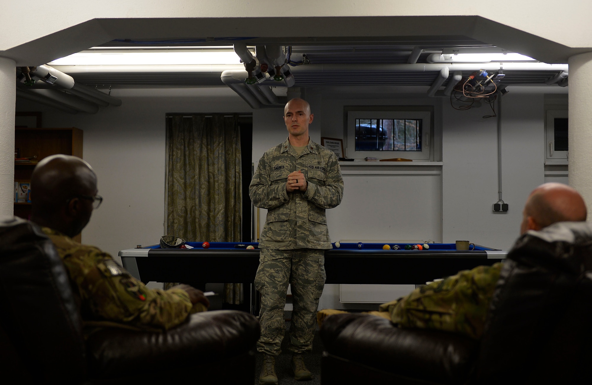 Maj. Corey Carnes, Deployment Transition Center director, conducts a welcome brief for redeploying Airmen on Ramstein Air Base, Germany, Feb. 2, 2017. The DTC takes redeployers through a four-day re-immersion course which aims to help them ease back into non-deployed life. (U.S. Air Force photo by Airman 1st Class Joshua Magbanua)

