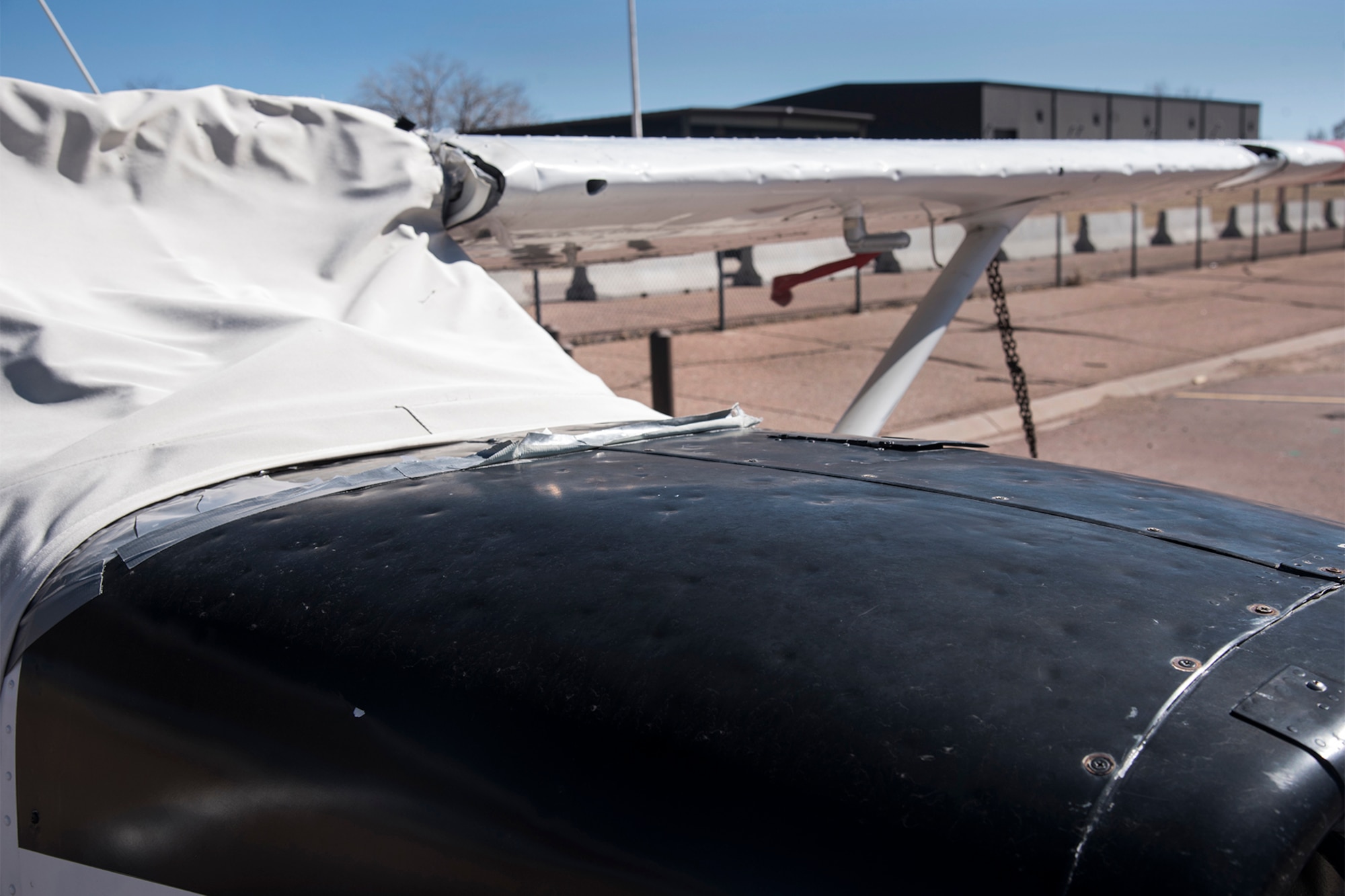 Four Cessna T-41 military training aircraft assigned to the Rocky Mountain U.S. Air Force Flight Training Center, also known as the Peterson Aero Club, wait for hail damage repair caused by the July 2016 hail storm at Peterson Air Force Base, Colo., March 7, 2017. The July hailstorm damaged six out of 11 Peterson Aero Club airplanes. The first of six airplanes was fully repaired and returned back to the fleet on Feb. 23, 2017. (U.S. Air Force photo by Staff Sgt. Tiffany Lundberg)