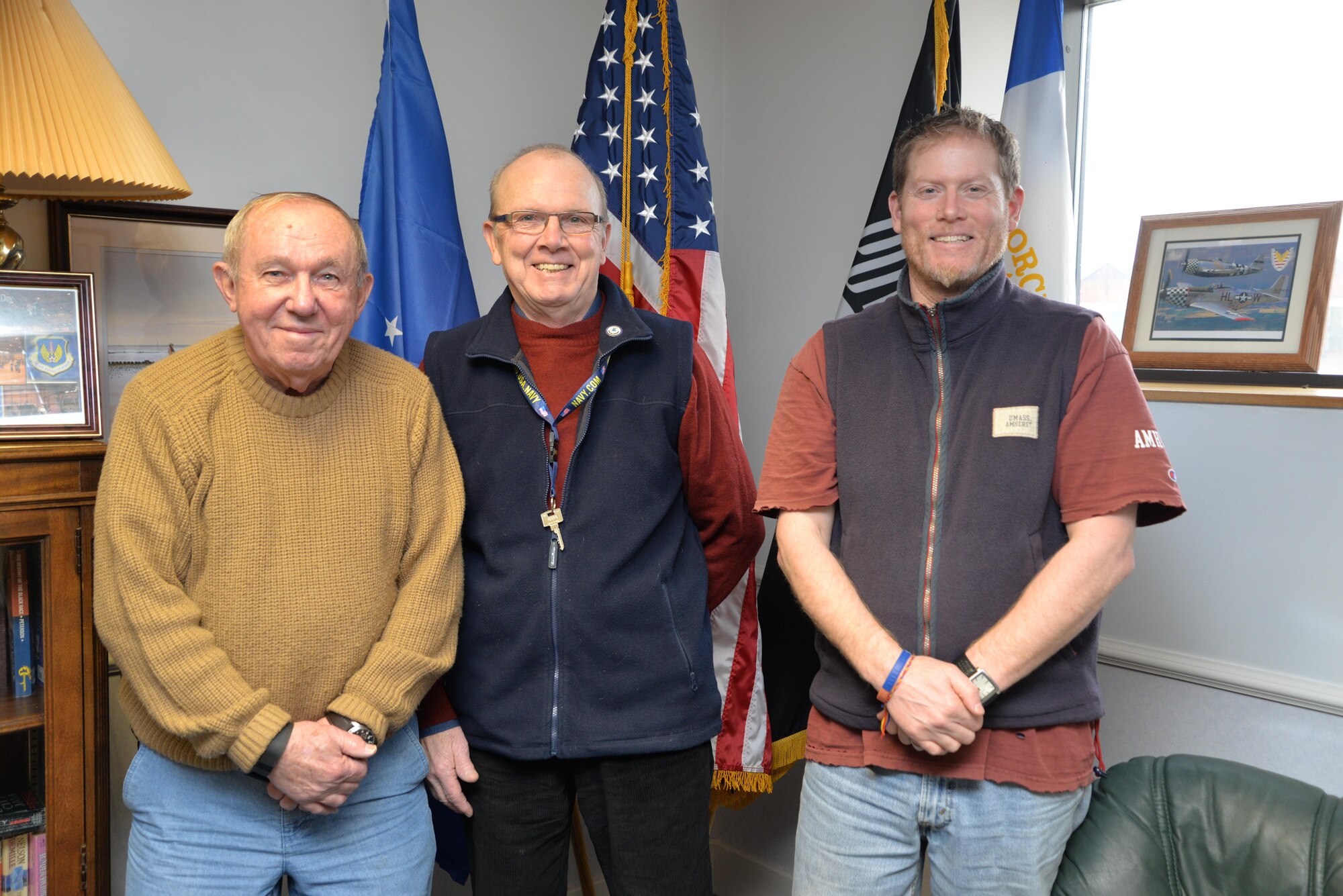From left to right, Dick Good, retired U.S. Air Force chief master sergeant; Darrell Russell, retired U.S. Navy senior chief petty officer and Scott MacNeil, retired U.S. Air Force major, pose for a photograph February 10, 2017, on RAF Mildenhall, England. All three volunteer at the RAF Mildenhall Retiree Activities Office and provide a wealth of knowledge and support to retirees around the United Kingdom. (U.S. Air Force photo by Karen Abeyasekere) 
