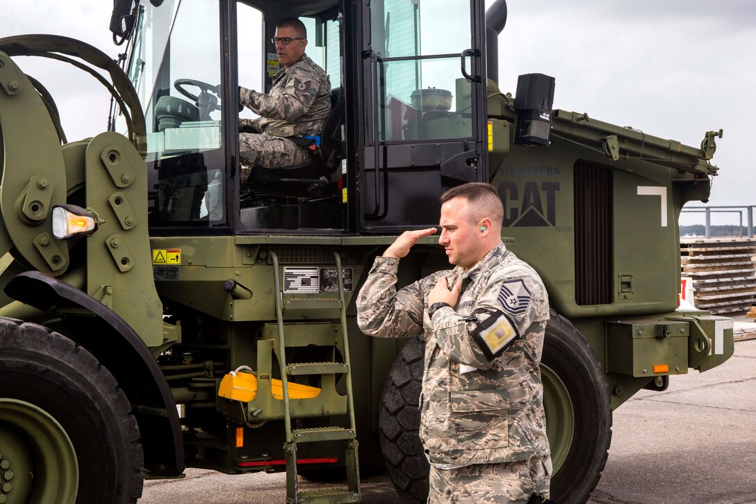 Air Force Master Sgt. Matthew Buonaspina, foreground, directs a loader during Crisis Response 17 at the Combat Readiness Training Center, Gulfport, Miss., March 5, 2017. Buonaspina is assigned to the 35th Aerial Port Squadron, 514th Air Mobility Wing. About 700 airmen with the 514th Air Mobility Wing, the 305th Air Mobility Wing, the 87th Air Base Wing and the 621st Contingency Response Wing participated in the mobilization exercise. Air Force photo by Master Sgt. Mark C. Olsen