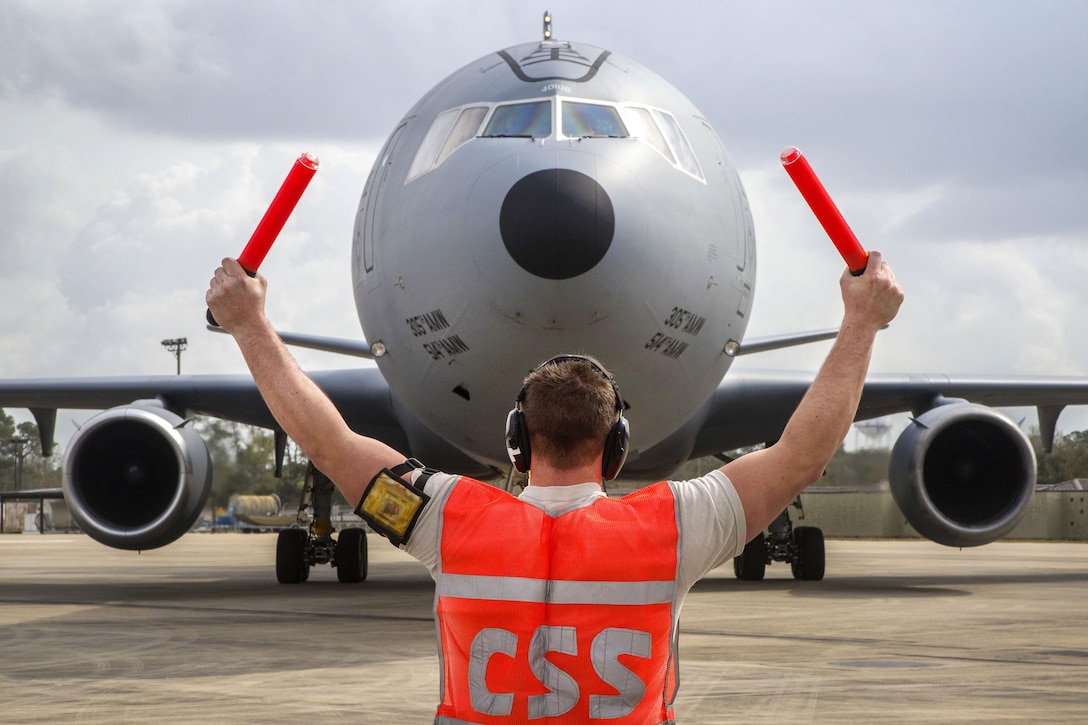 Air Force Airman 1st Class Jacob Coles marshals a KC-10 Extender during Crisis Response 17 at the Combat Readiness Training Center, Gulfport, Miss., March 5, 2017. Coles is assigned to the 605th Aircraft Maintenance Squadron, Air Mobility Command. Air Force photo by Master Sgt. Mark C. Olsen  