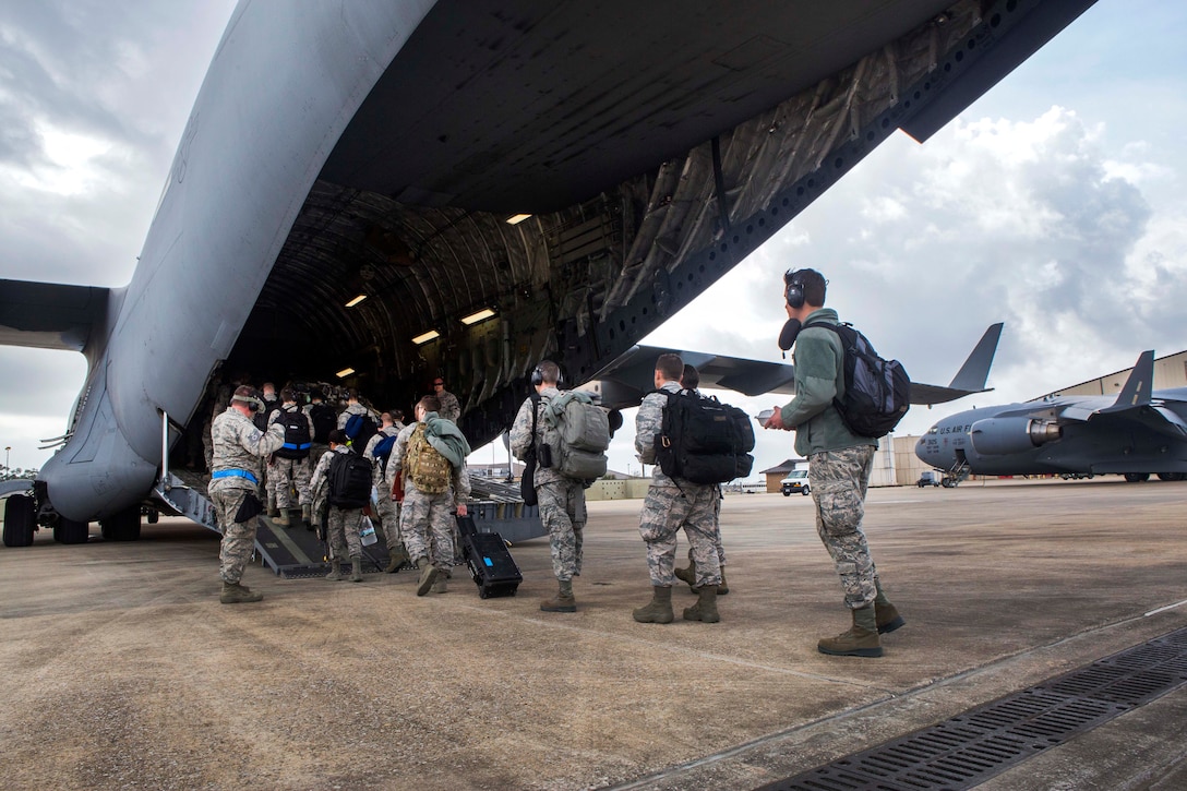Airmen board a C-17 Globemaster III aircraft that will fly them back to Joint Base McGuire-Dix-Lakehurst, N.J., during Crisis Response 17 at the Combat Readiness Training Center, Gulfport, Miss., March 5, 2017. The airmen are assigned to the 621st Contingency Response Wing. The C-17 crew is assigned to the 305th Air Mobility Wing. Air Force photo by Master Sgt. Mark C. Olsen