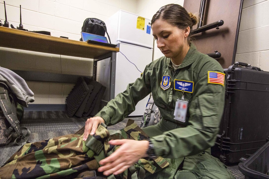 Air Force Staff Sgt. Ana Nichols packs her chemical, biological, radiological and nuclear bag during Crisis Response 17 at the Combat Readiness Training Center, Gulfport, Miss., March 5, 2017. Nichols is assigned to the 514th Aeromedical Evacuation Squadron, Air Mobility Command. Air Force photo by Master Sgt. Mark C. Olsen