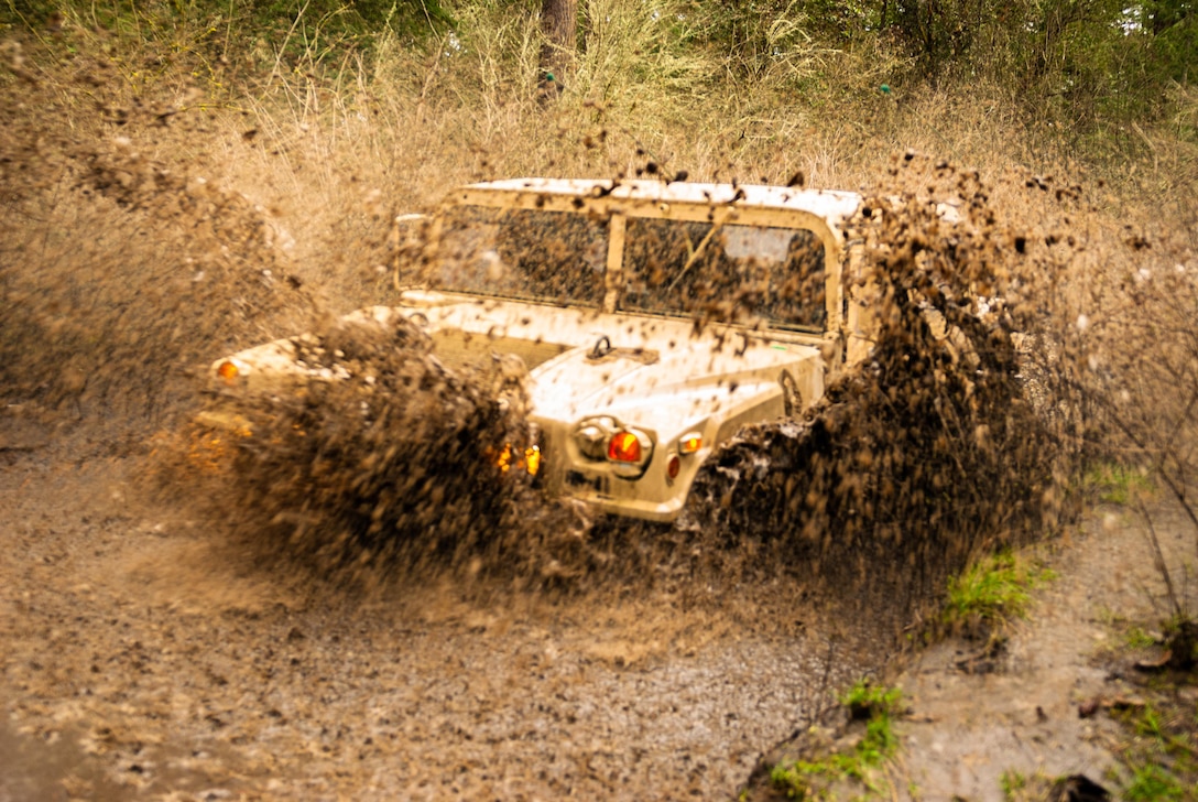 Soldiers from Headquarters and Headquarters Company, 301st Maneuver Enhancement Brigade, maneuver through difficult terrain on Joint Base Lewis-McChord, Washington, March 12, 2017. The city of Tacoma, Washington, receives an average rainfall of 40 inches of rain per year. 